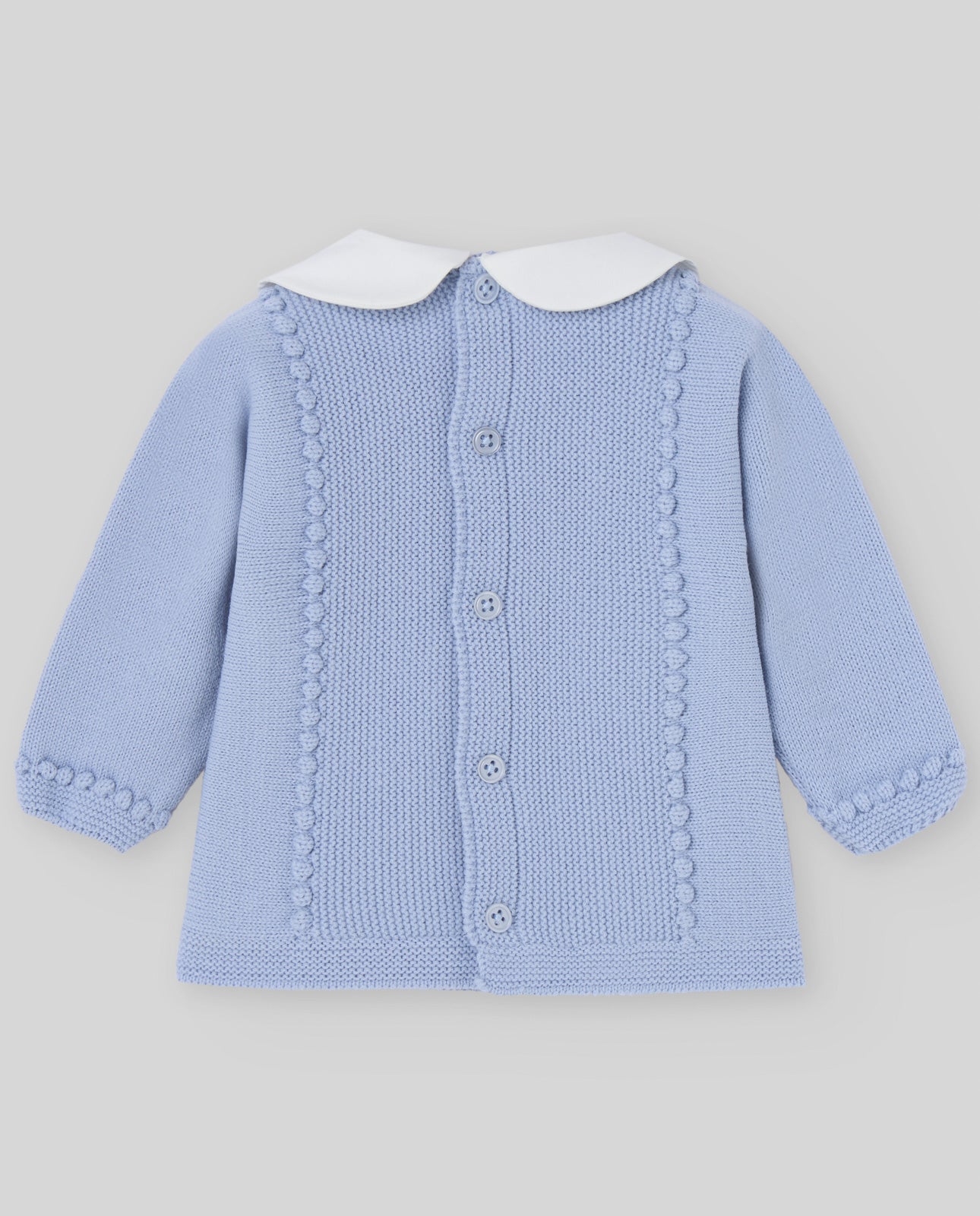 Light blue knitted cardigan with white collar on a light gray background