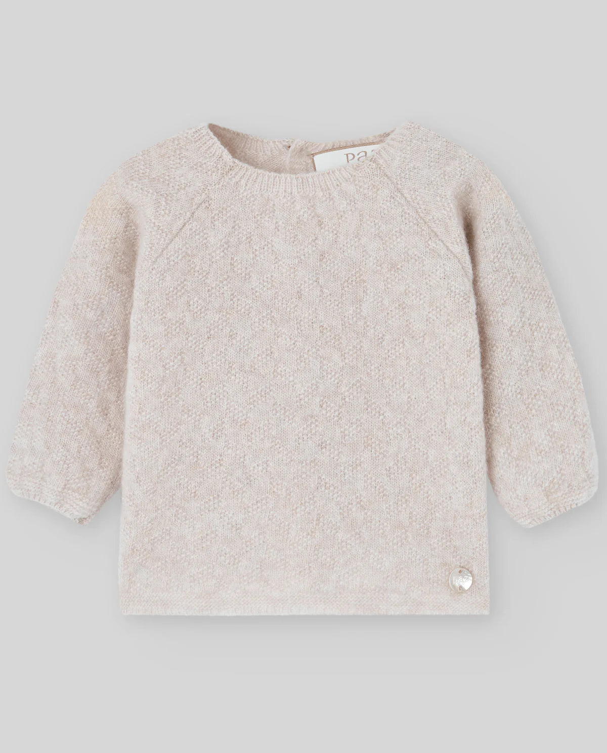 Beige fleece sweater on a light gray background