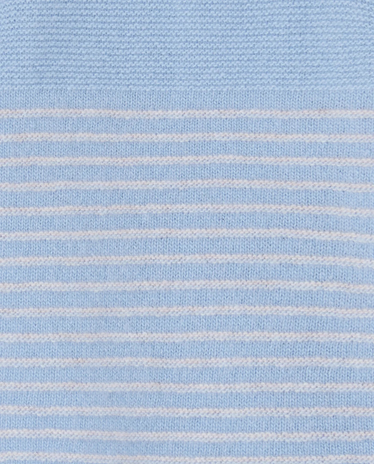 Close-up of light blue fabric with thin white stripes