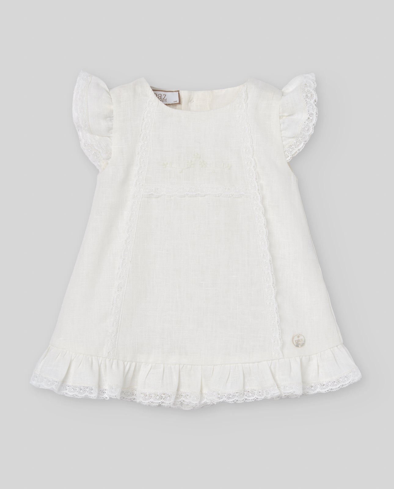 White dress with ruffled sleeves on a light gray background