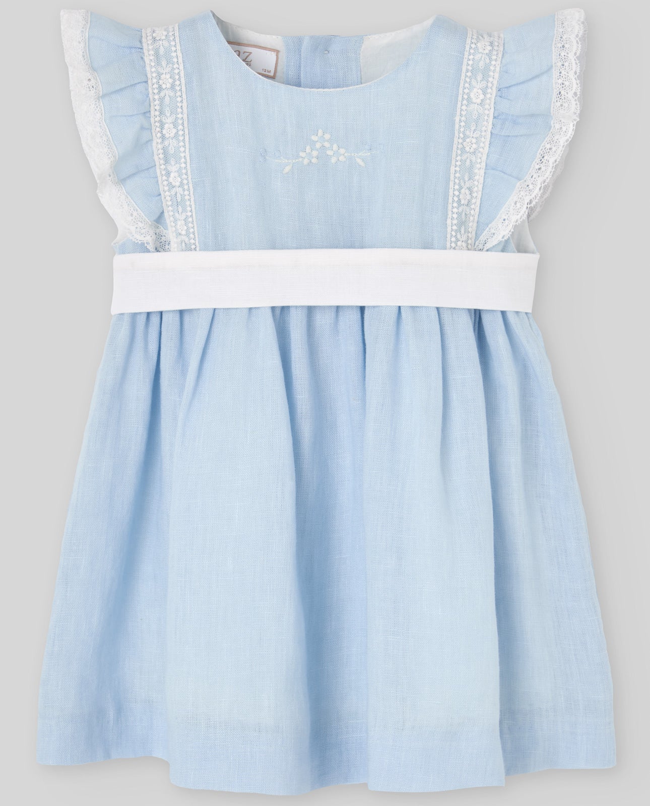 Light blue dress with white trim on a gray background