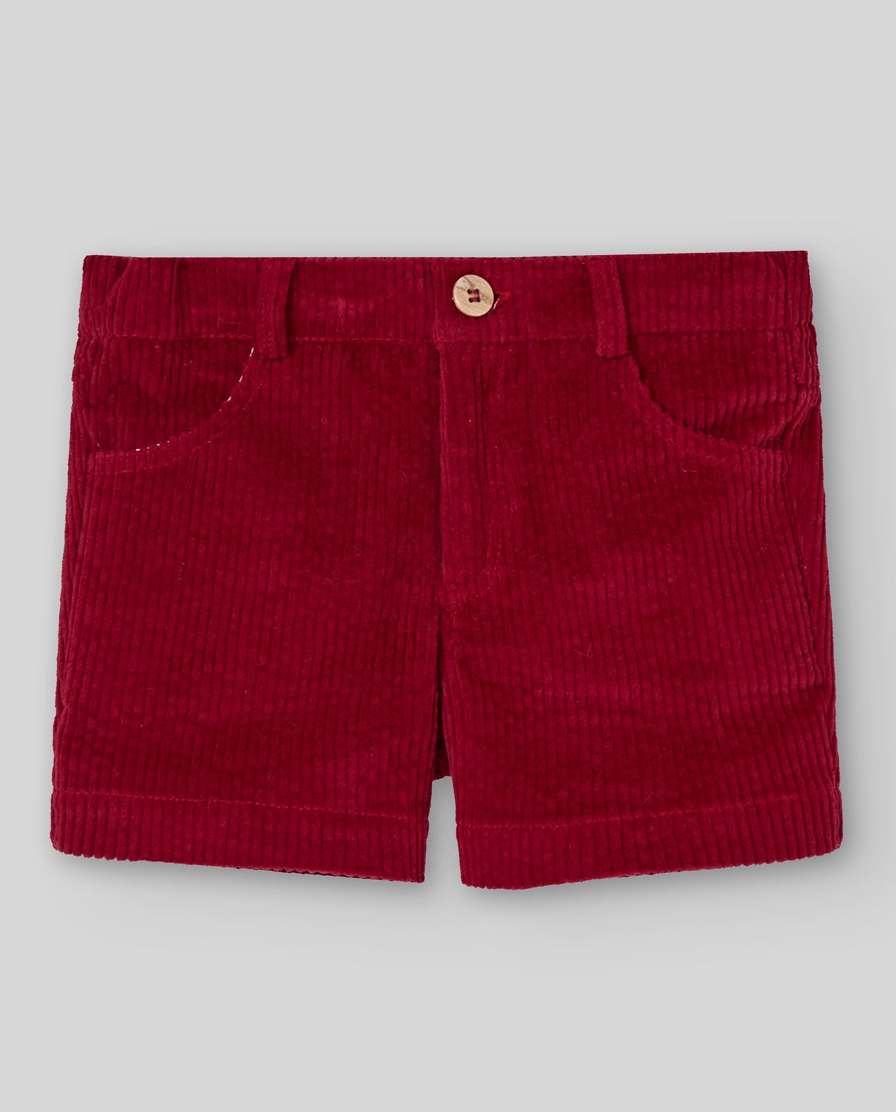Red corduroy shorts on a light gray background