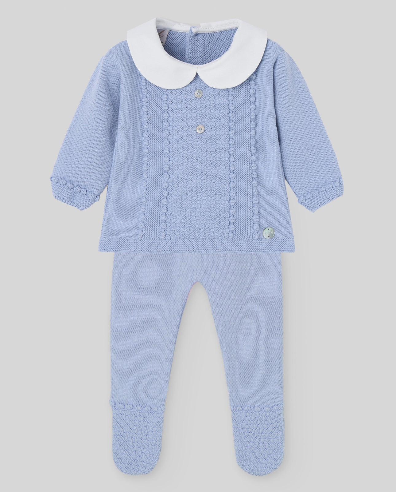 Blue baby outfit with white collar on a light gray background
