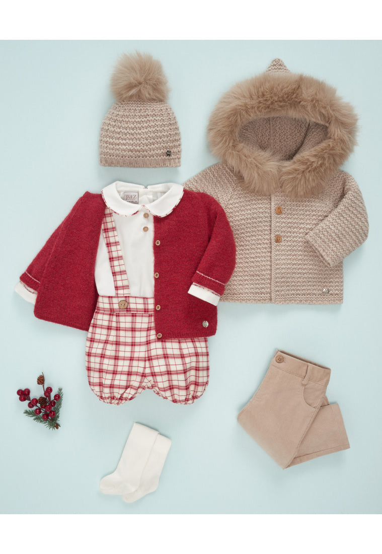 Children's winter clothing set including a coat, hat, and pants on a light blue background