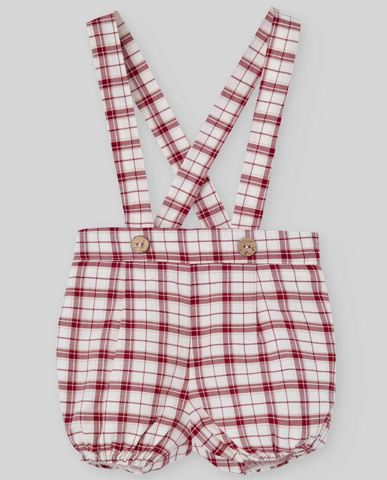 Red and white checkered baby romper with suspenders on a light gray background