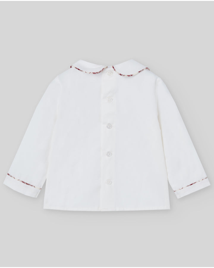 White shirt with red trim on a light gray background