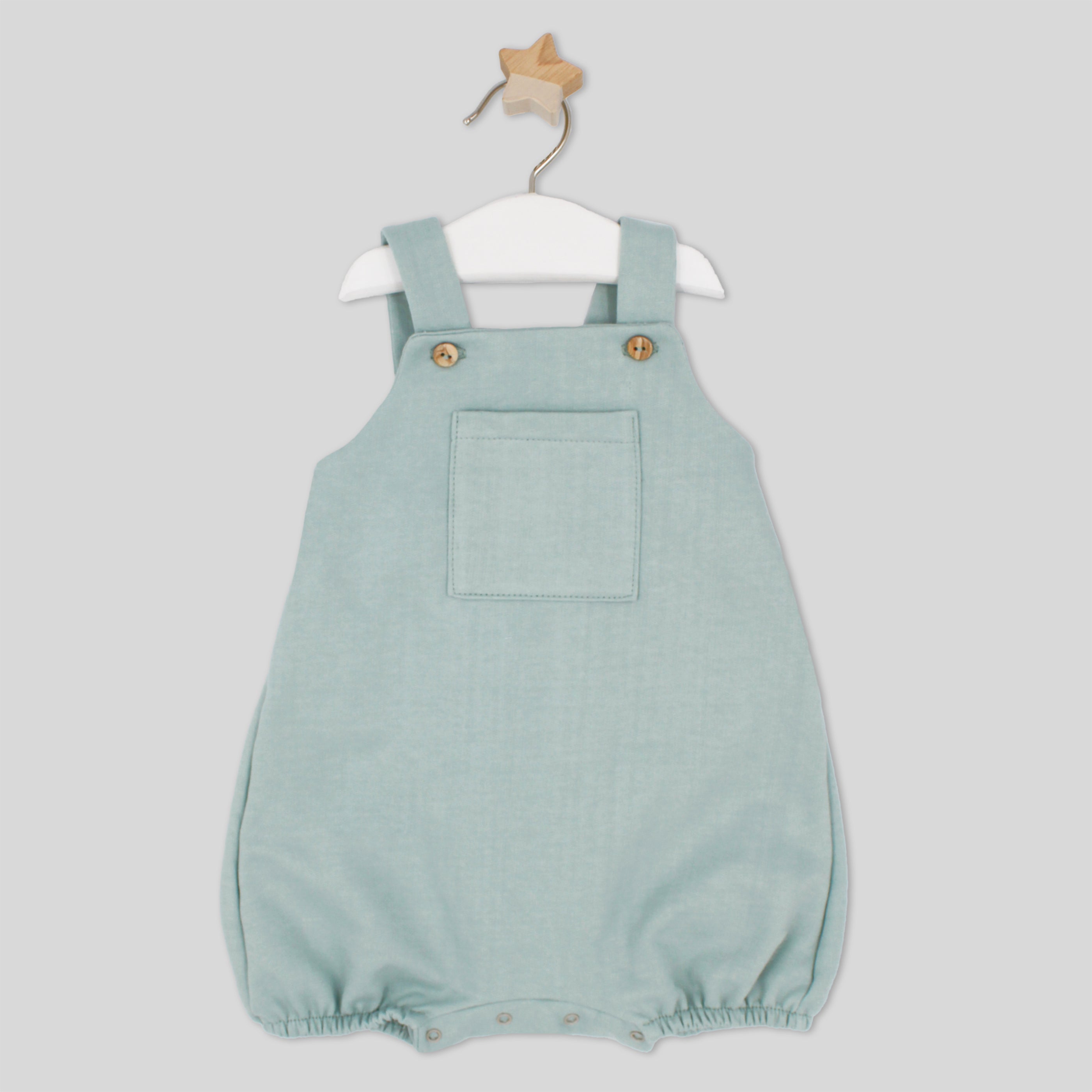Light blue baby romper with straps on a white background