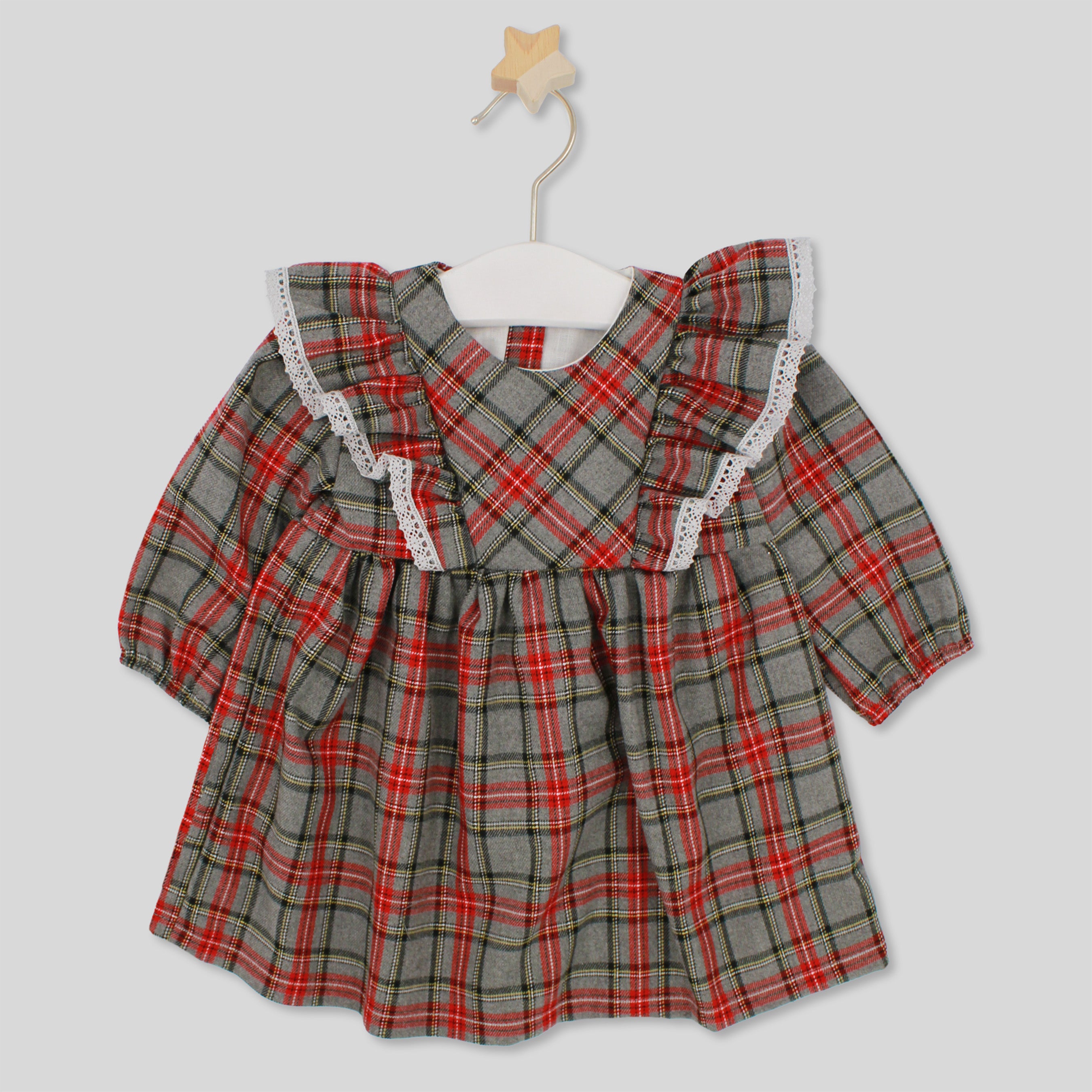 Plaid dress with lace trim on a white background