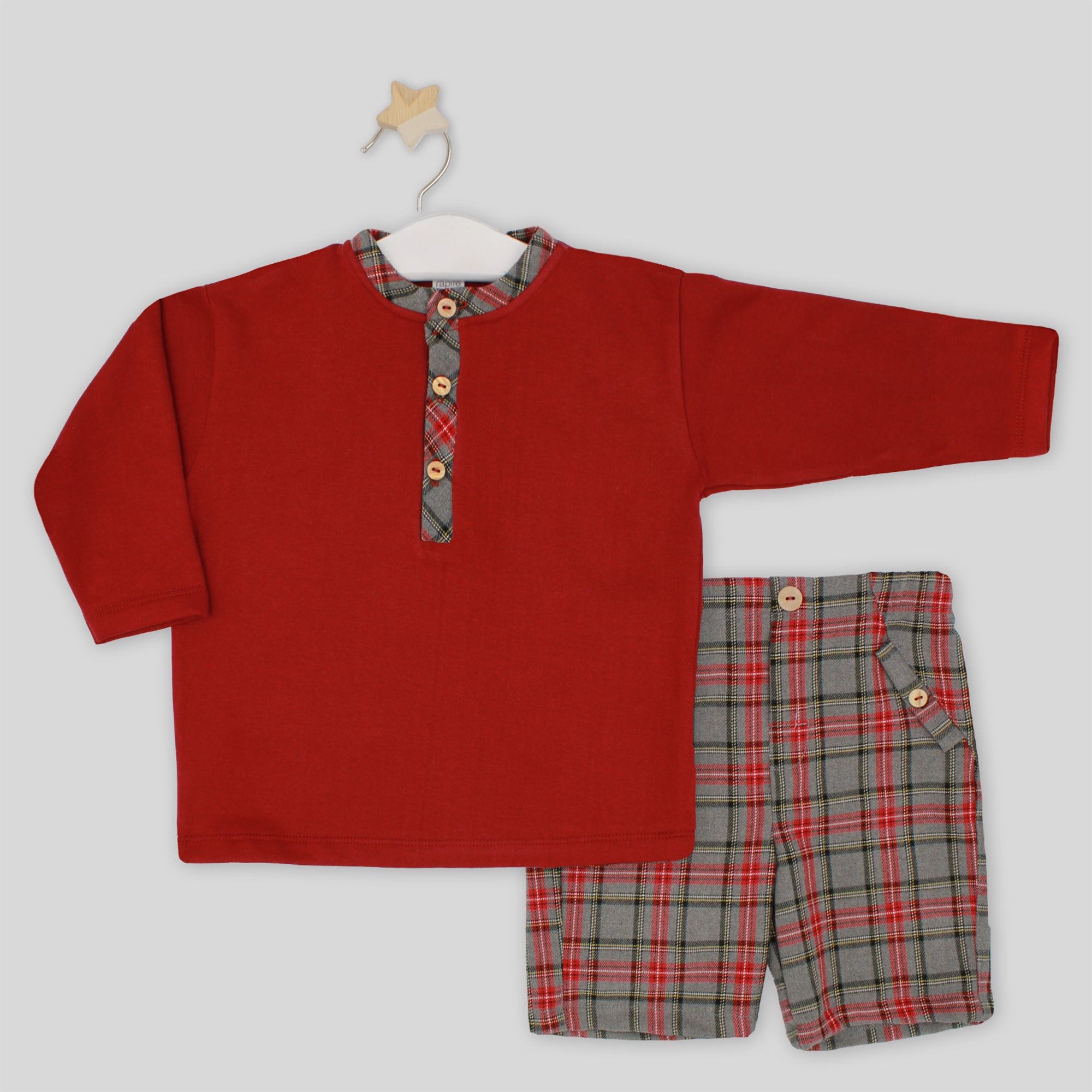 Red long-sleeve shirt and plaid shorts set on a white background