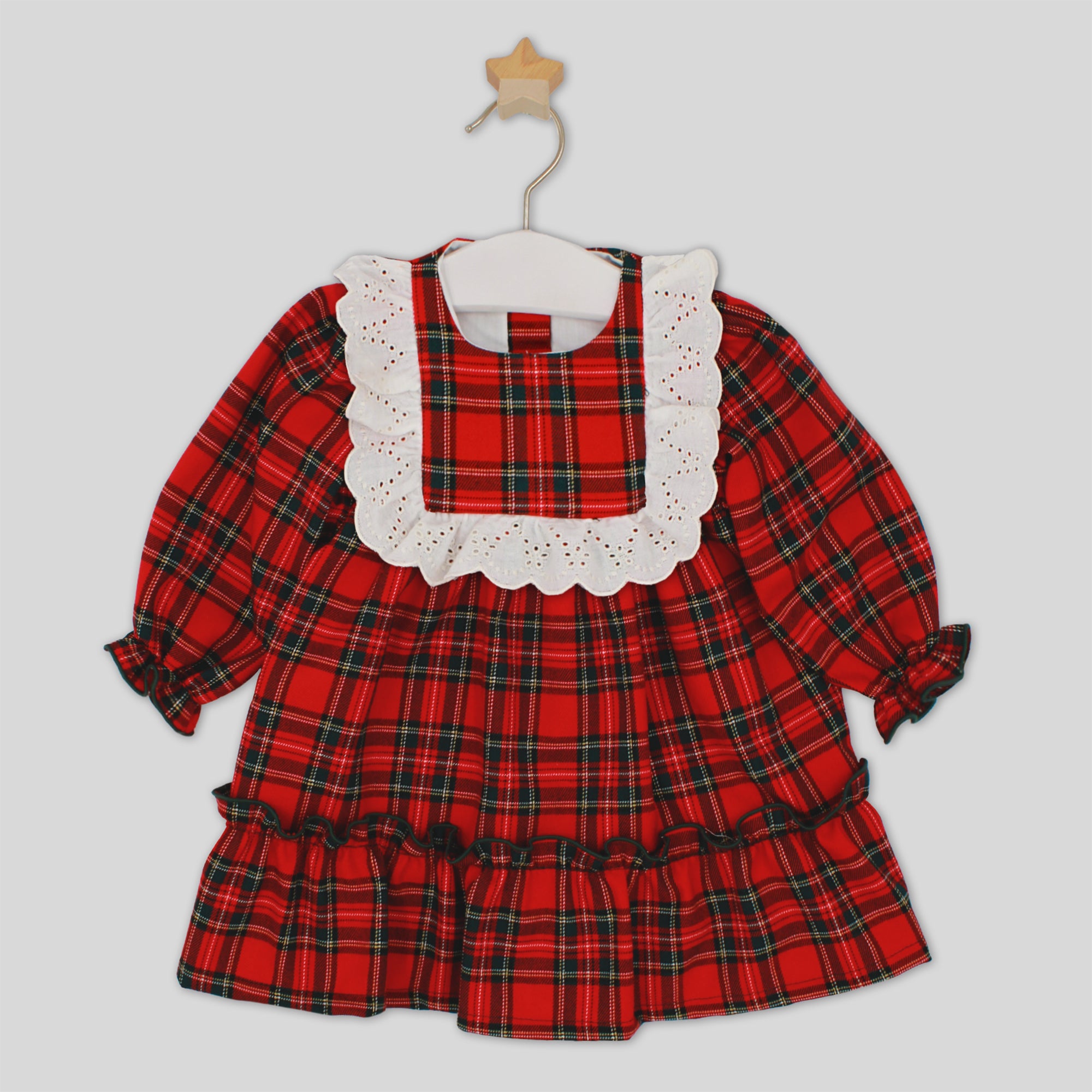 Red plaid dress with white lace collar on a hanger against a light gray background