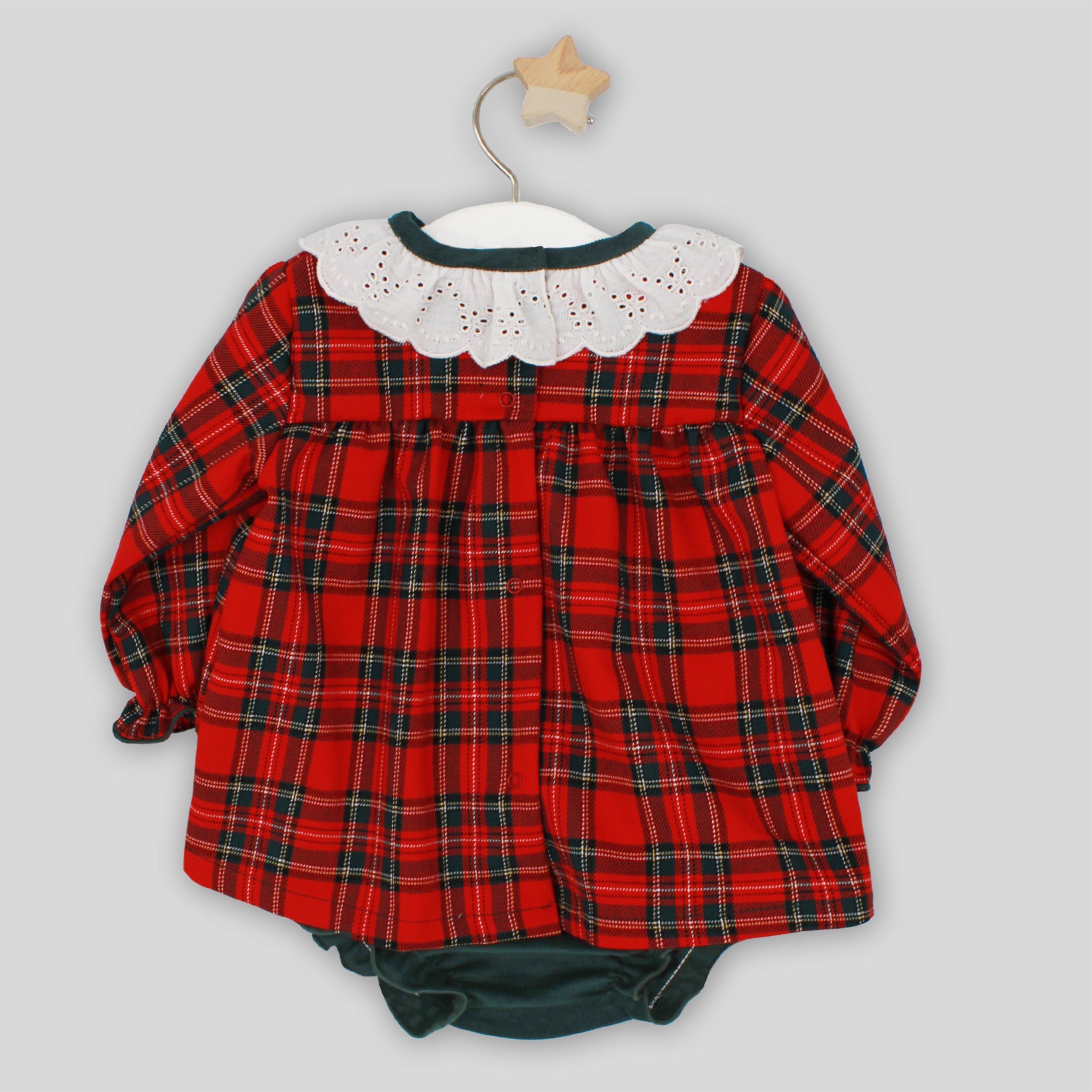 Red plaid baby outfit with white collar on a gray background