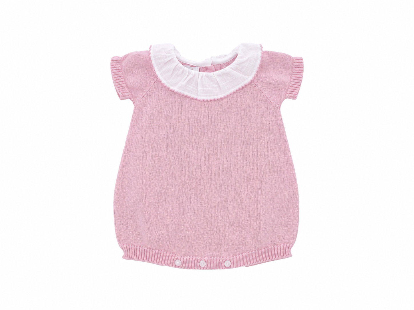 Pink knitted baby dress with white collar on a white background