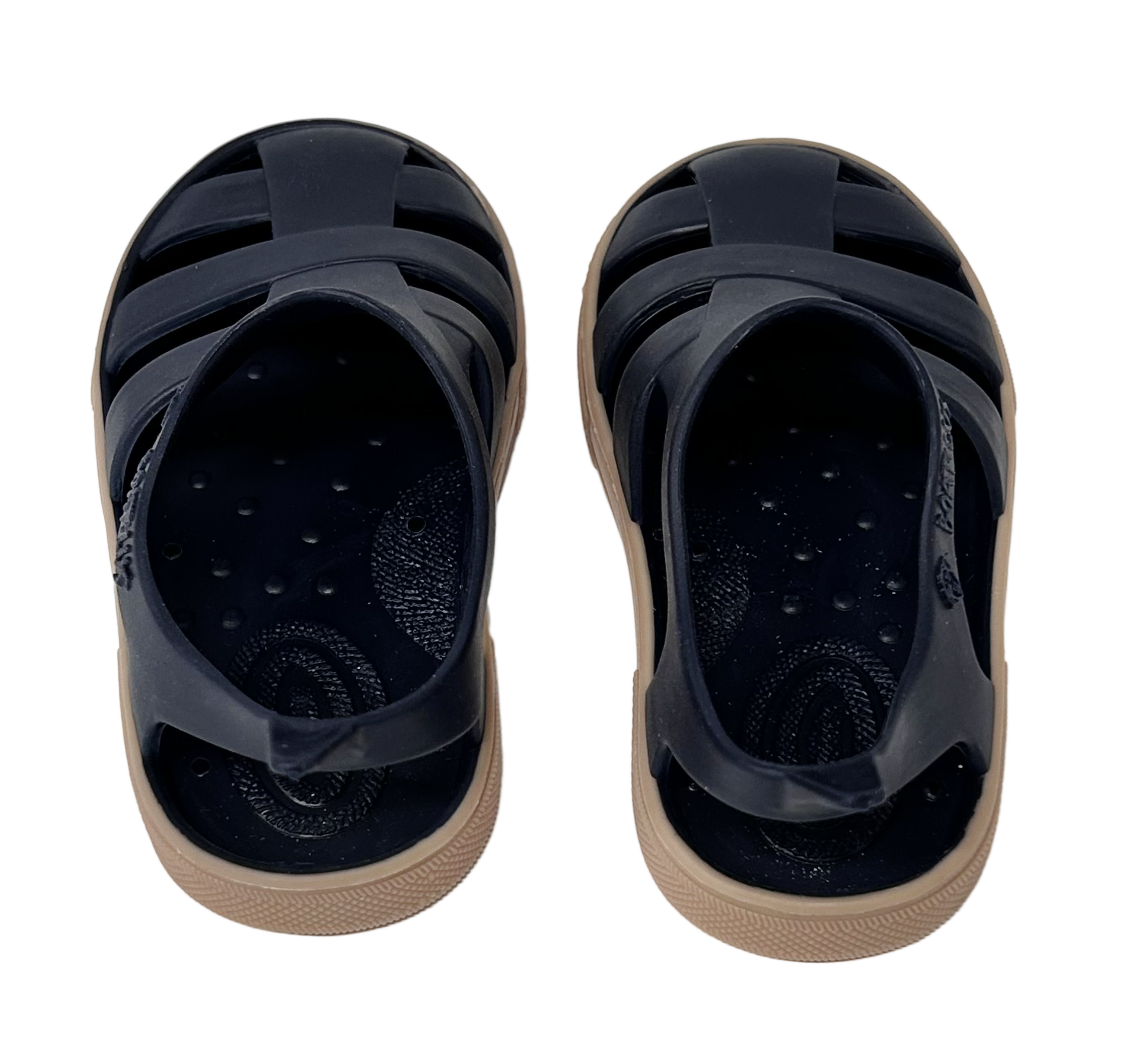 Pair of black sandals with beige soles on a white background