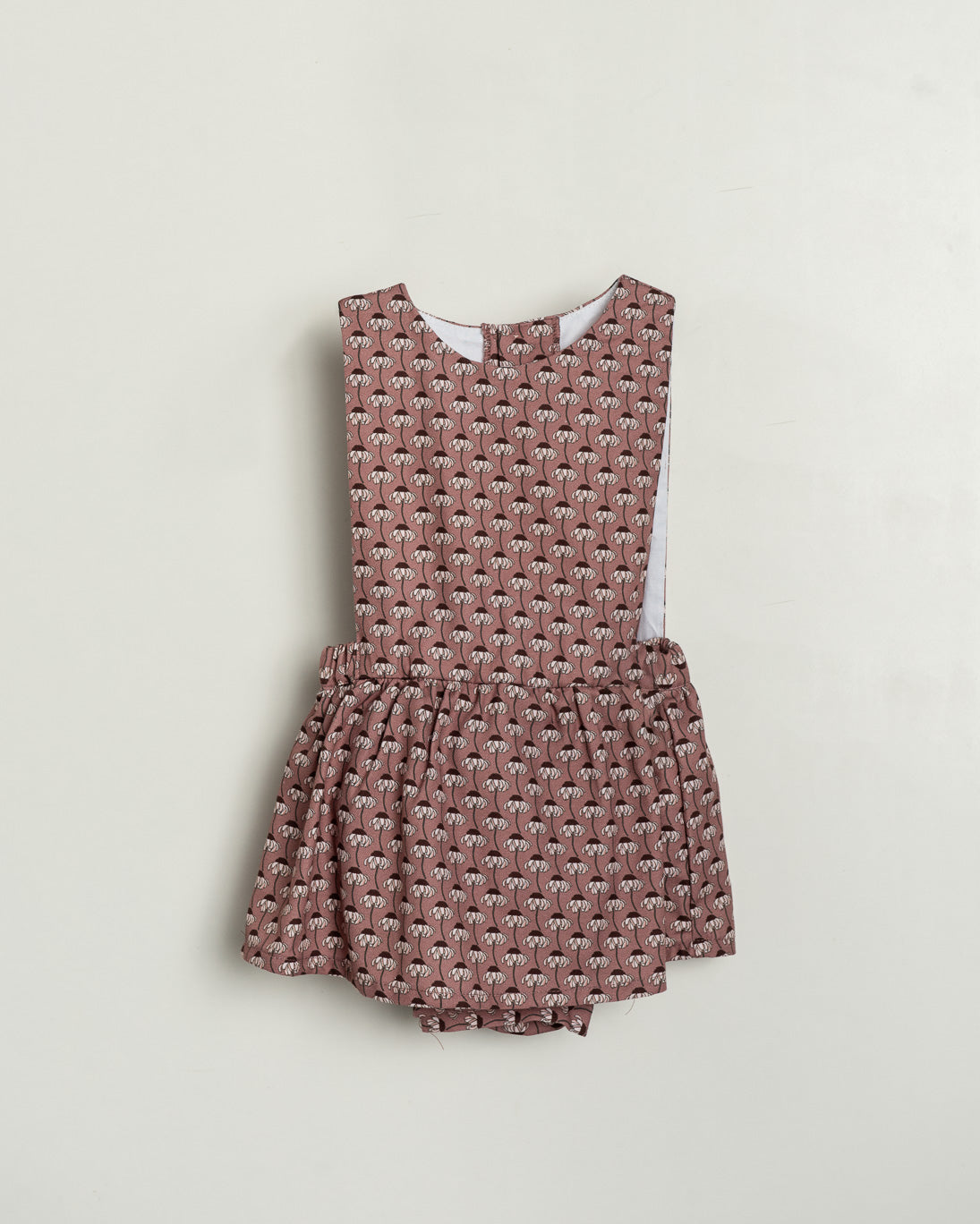 Patterned romper on a light gray background