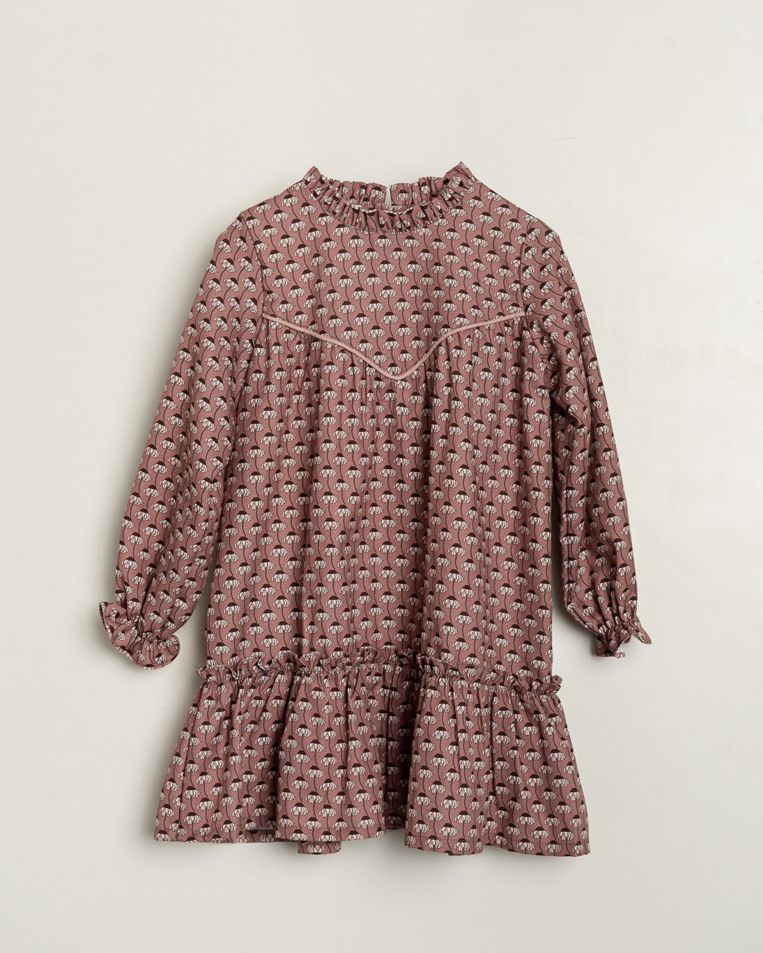 Pink patterned dress on a light beige background