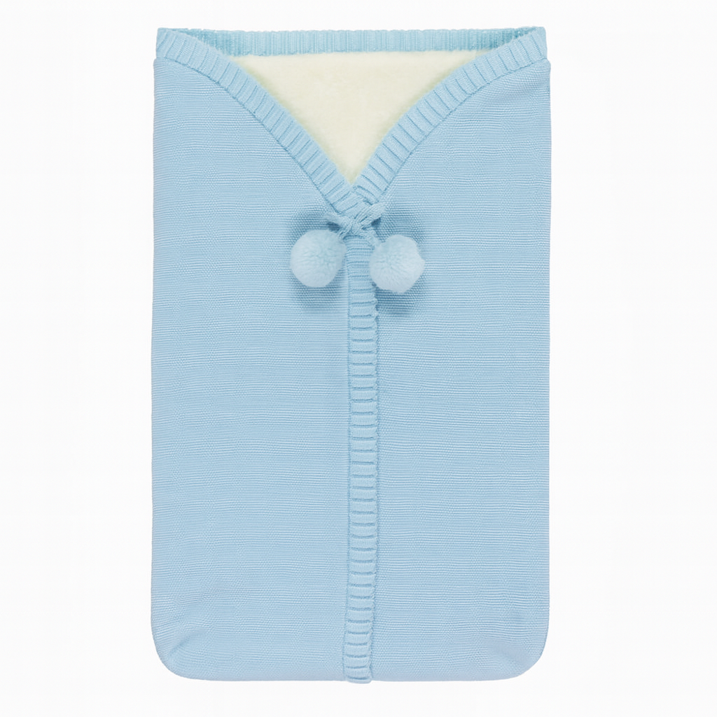 Light blue baby blanket with pom-pom details on a white background