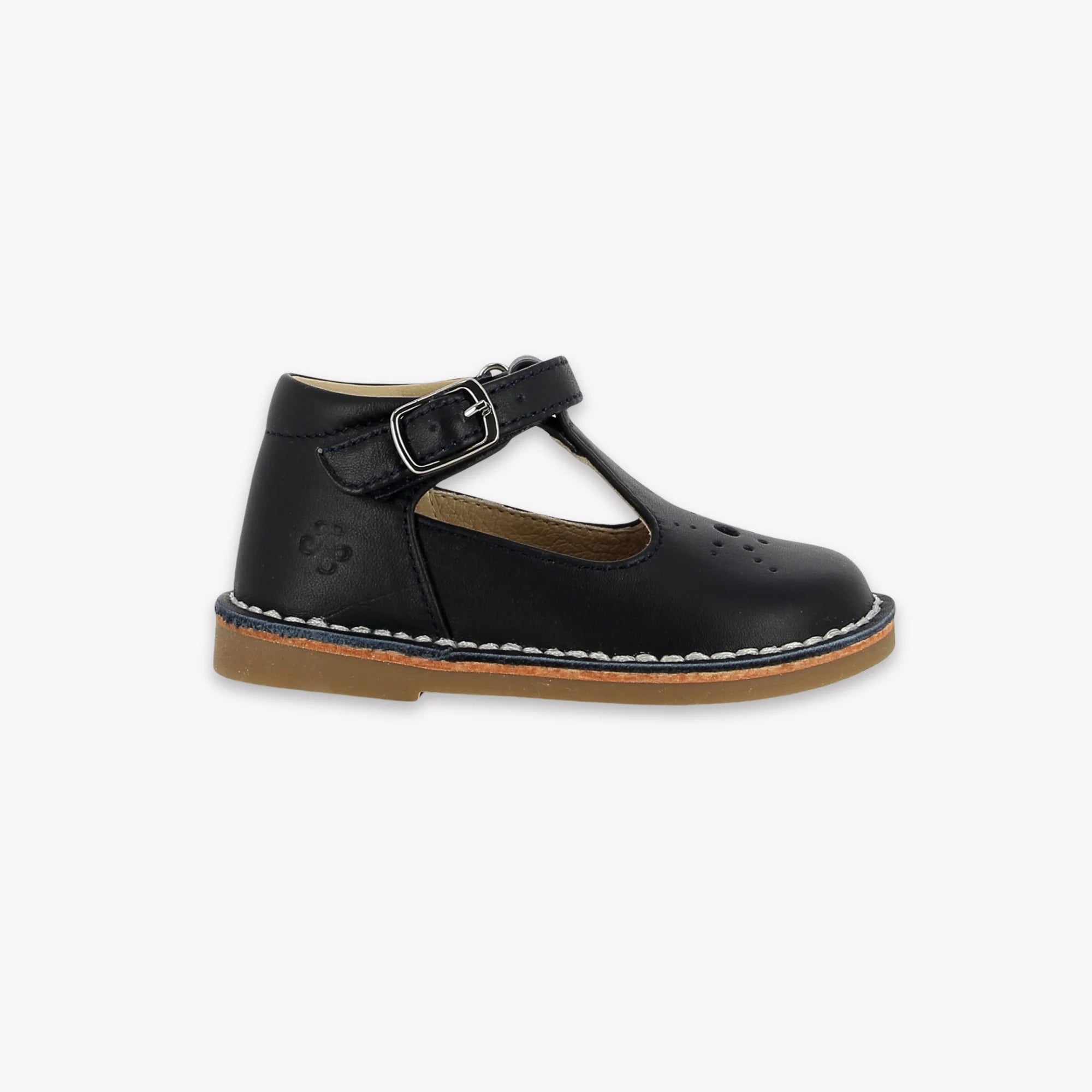 Navy leather shoe with a buckle on a white background