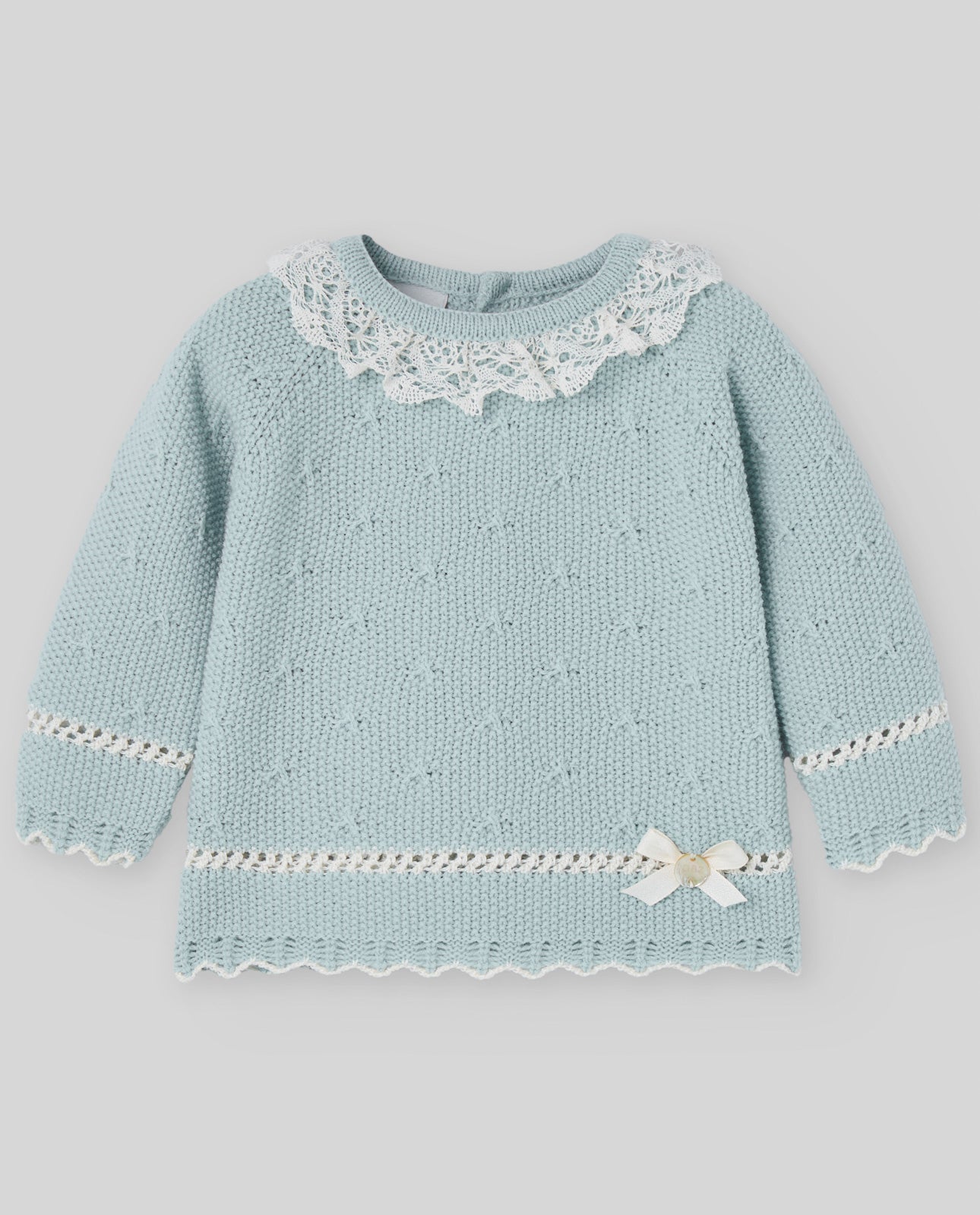 Light blue knitted sweater with lace details on a gray background