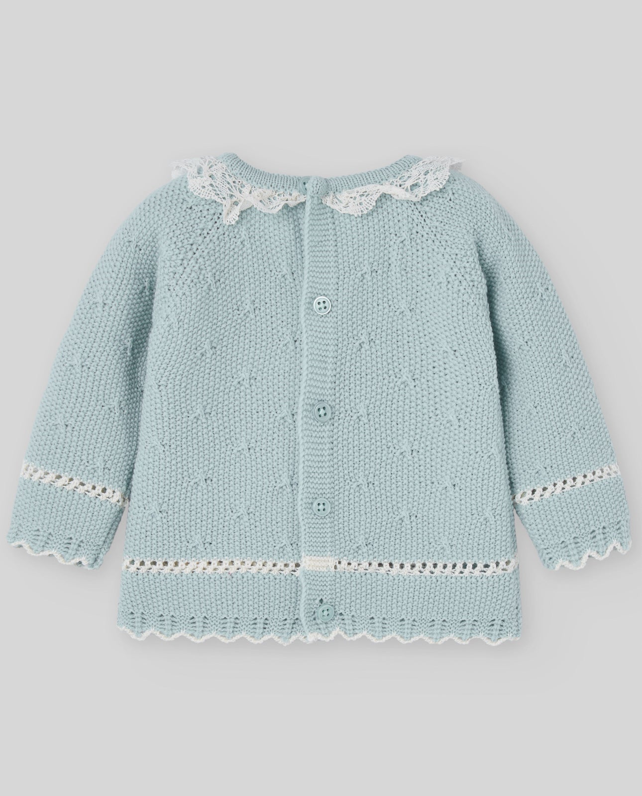 Light blue knitted cardigan with white lace details on a gray background