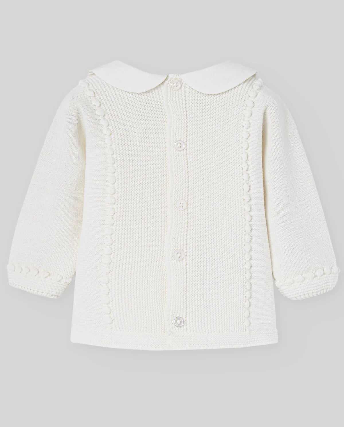 White baby cardigan on a light gray background