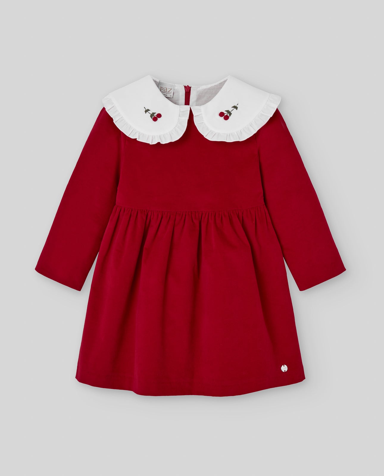 Red dress with white collar on a light gray background