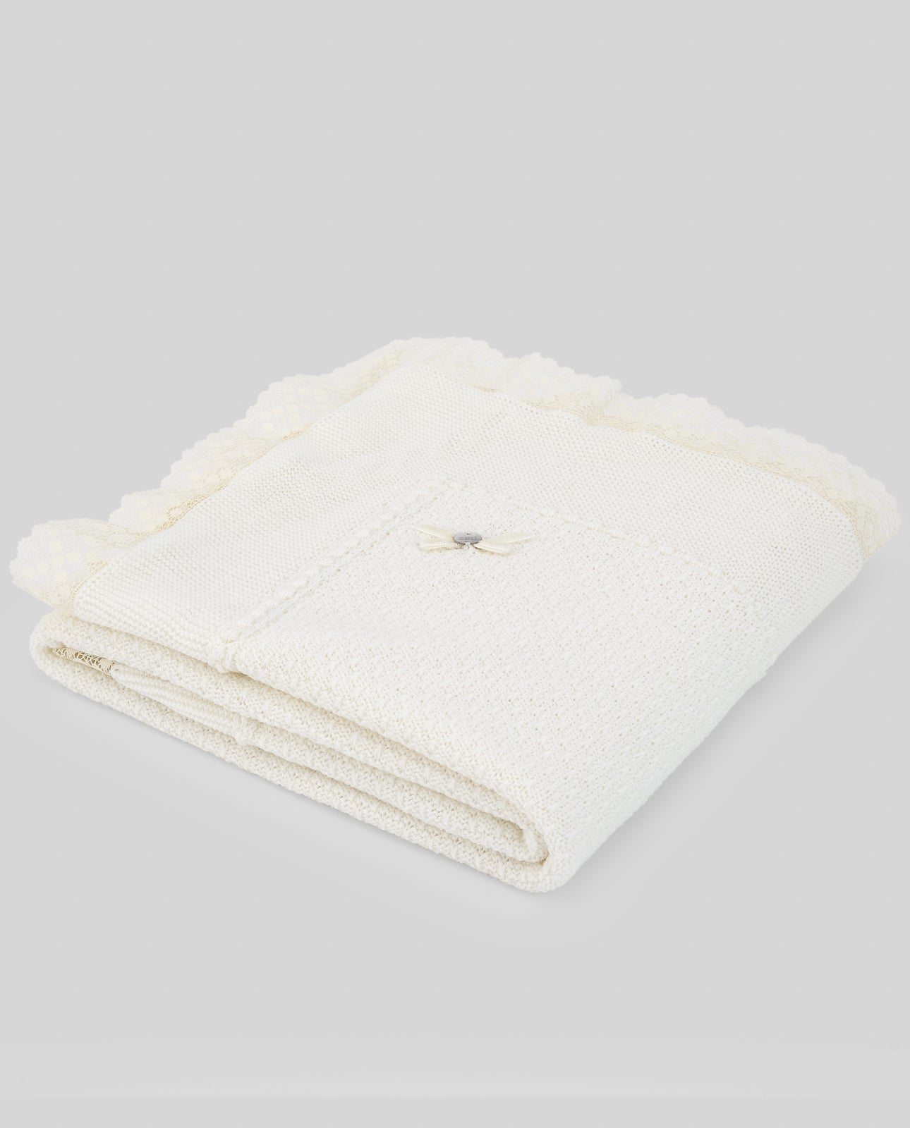 Folded white towel on a light gray background