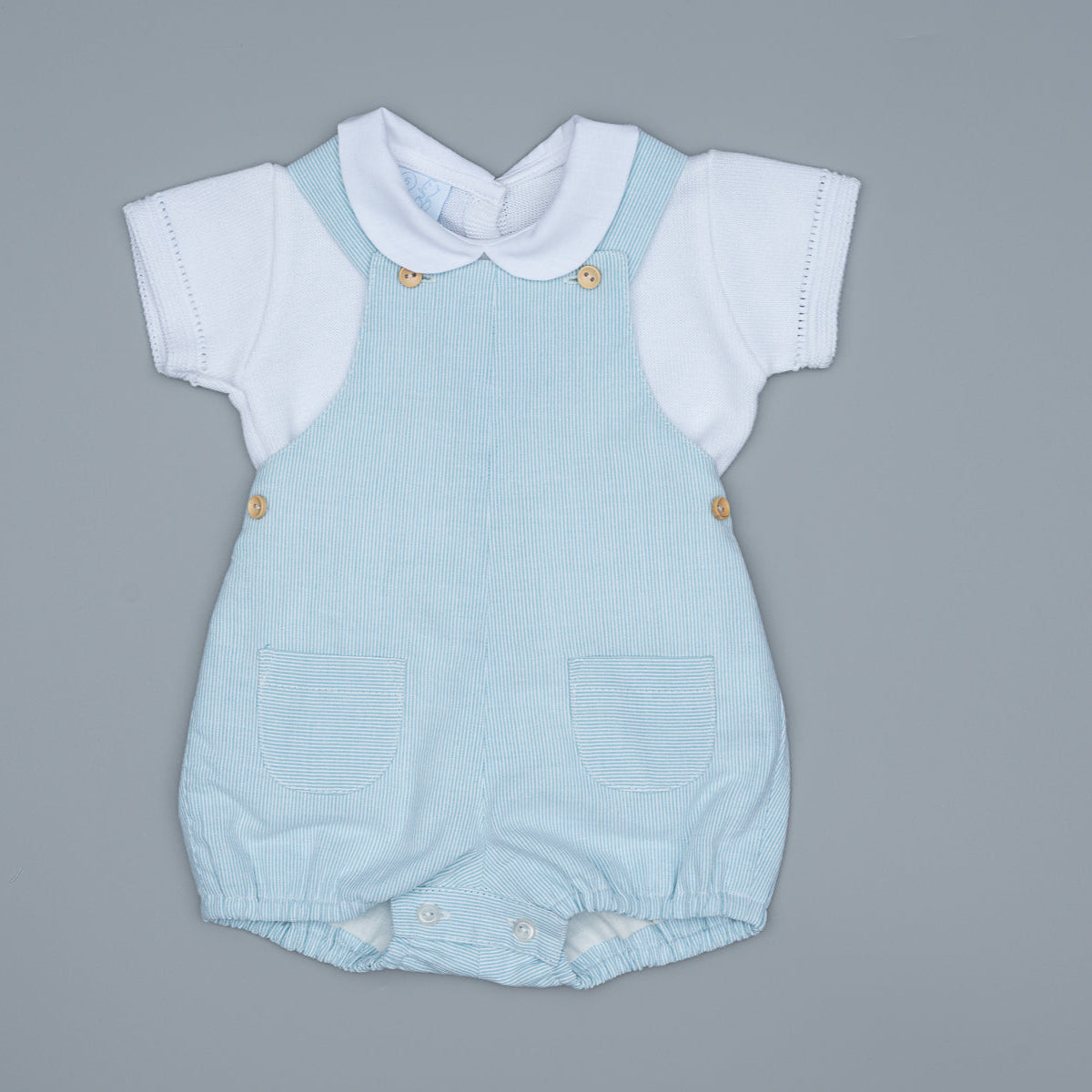 Light blue baby romper with white collar on a gray background