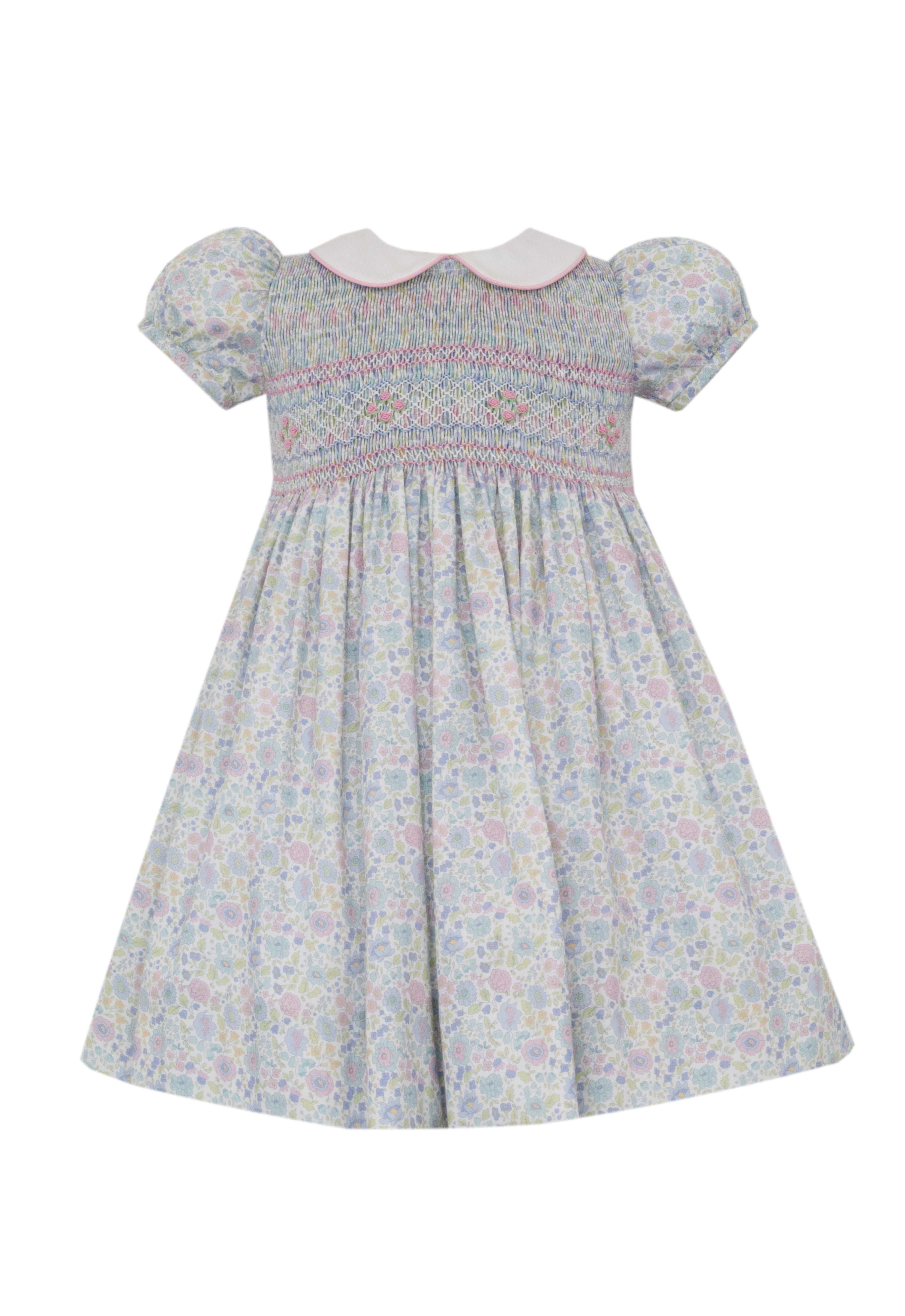 Floral dress with smocked details on a white background