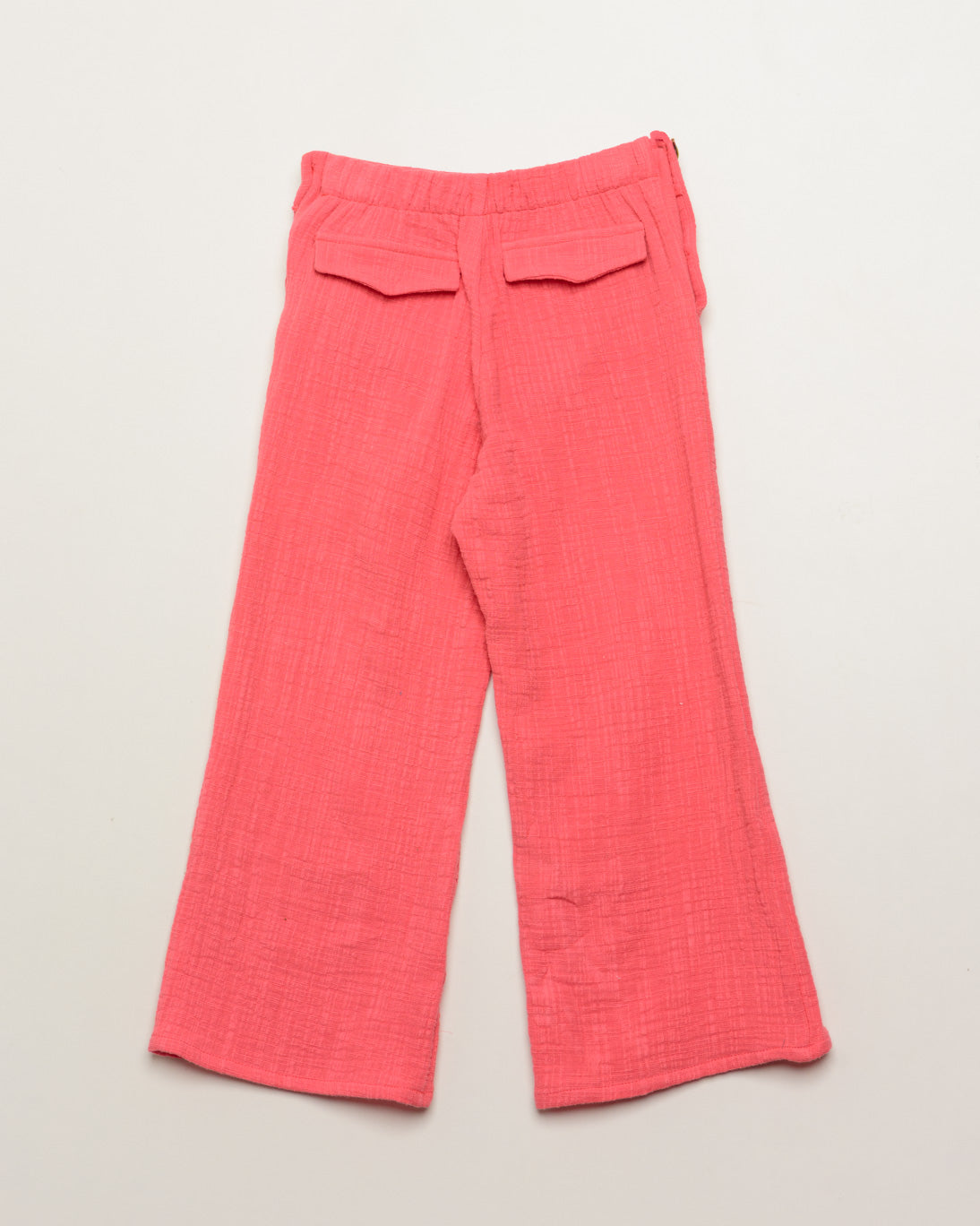 Pink pants on a light beige background