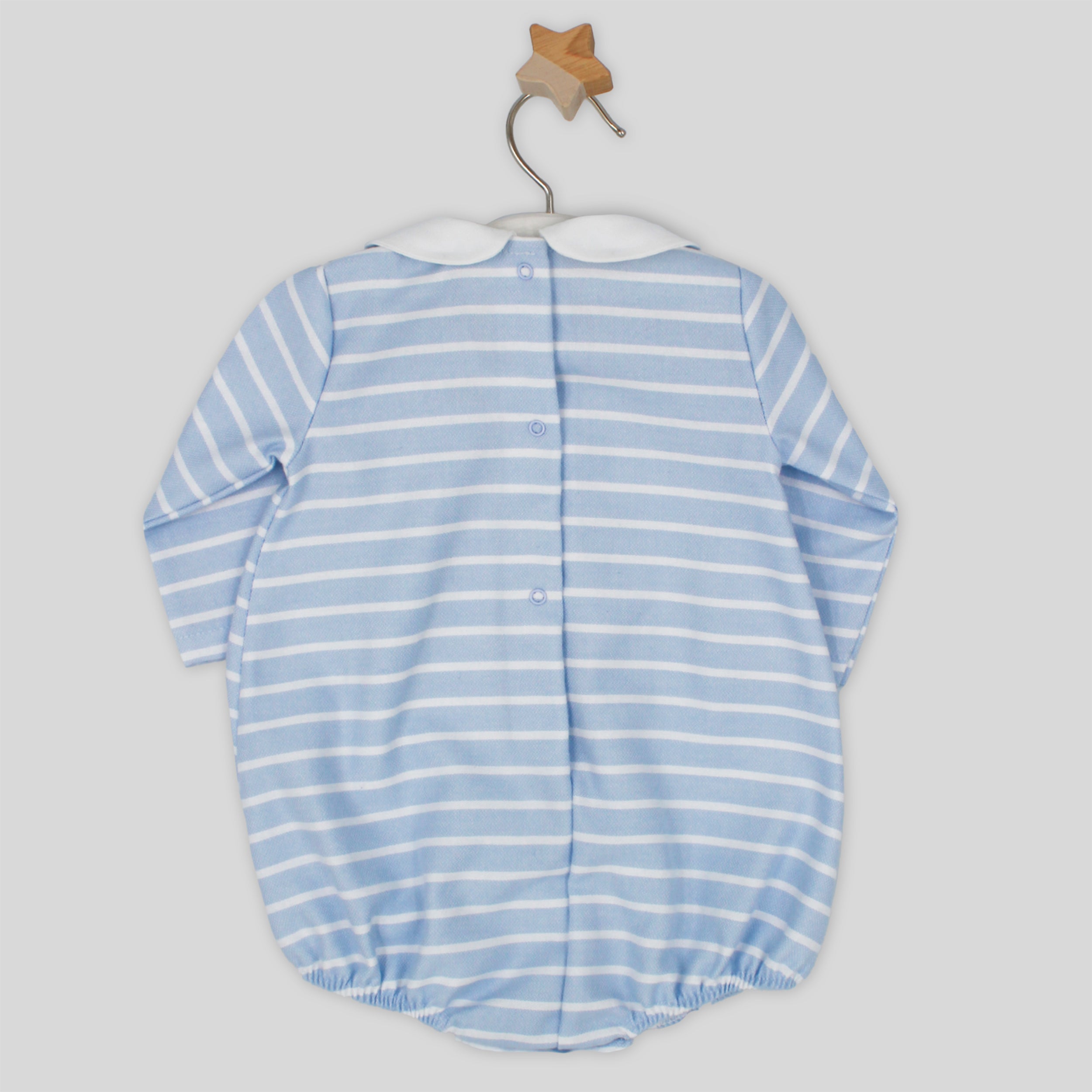 Blue and white striped baby romper on a hanger against a light gray background