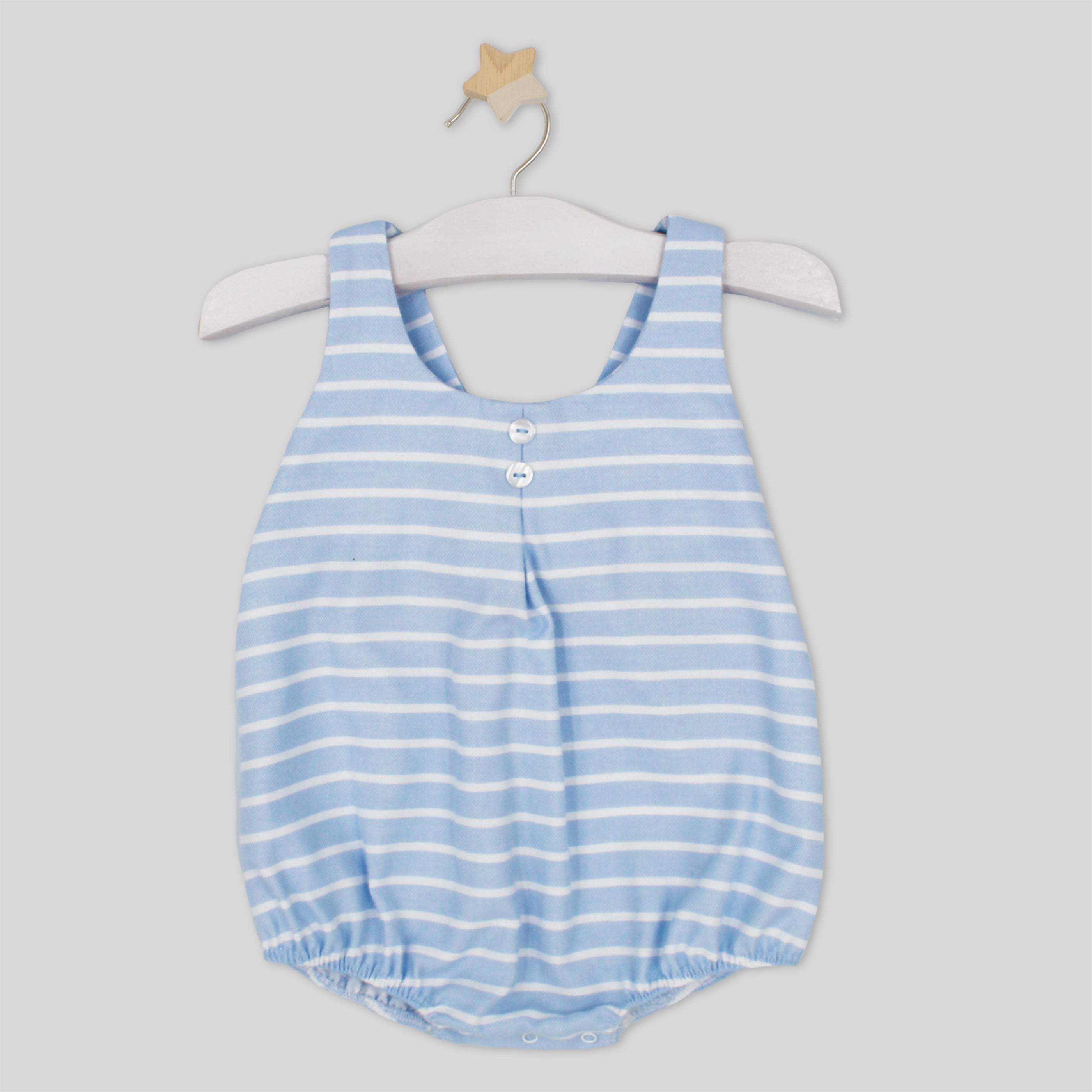 Blue and white striped baby romper on a hanger against a light gray background