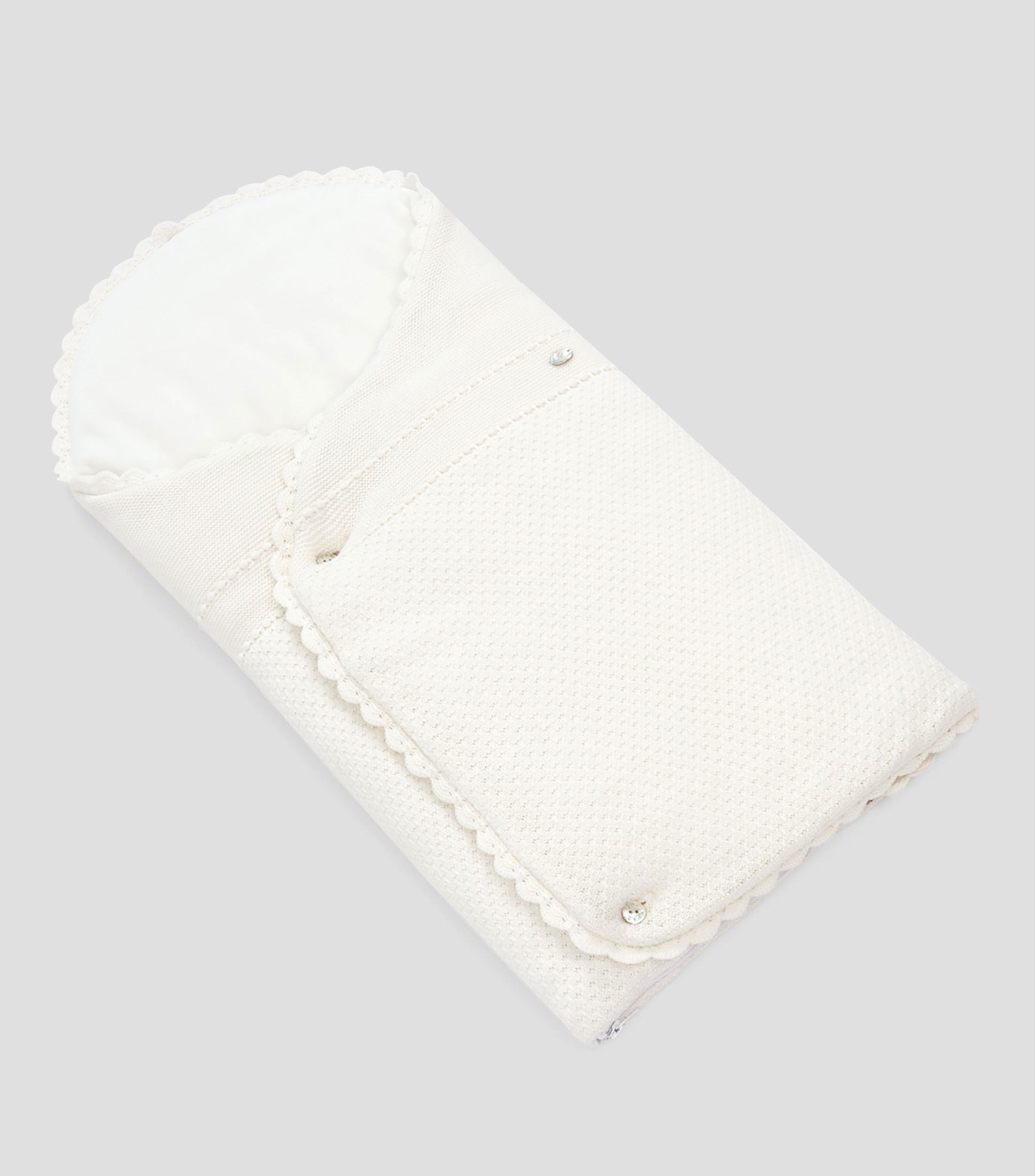 White baby nest on a gray background