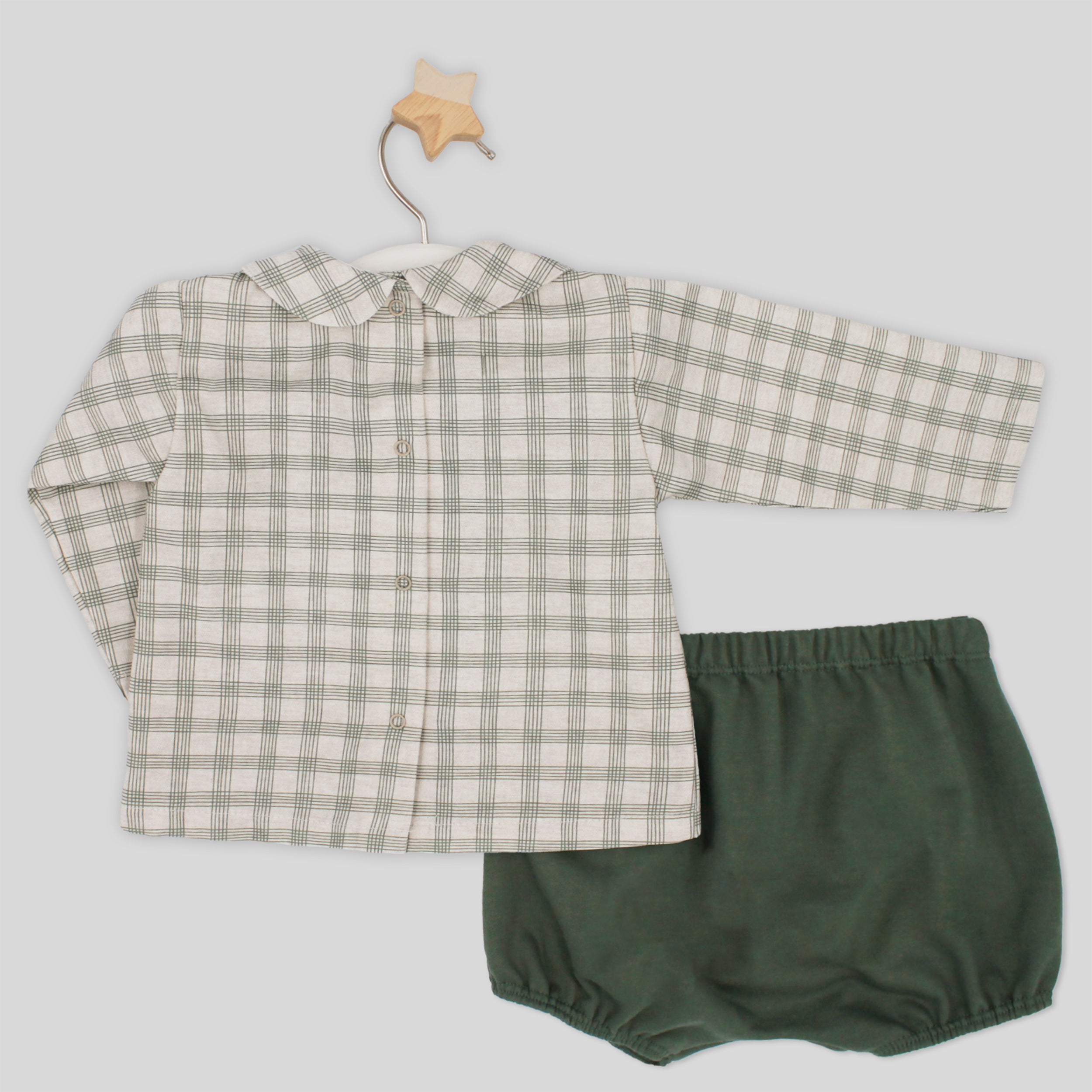 Checkered shirt and green bloomers on a light gray background