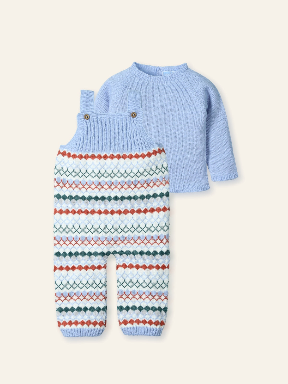 Light blue sweater and patterned pants set on a white background