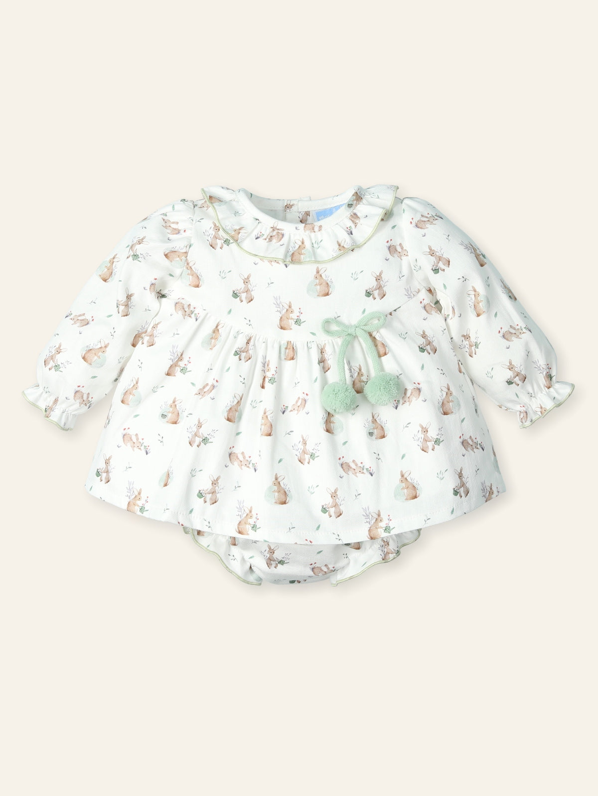 Baby dress with bunny print on a white background