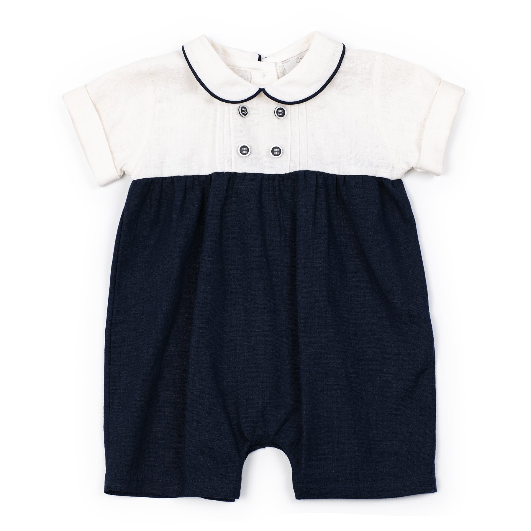 Navy blue and white baby romper with a collar on a white background