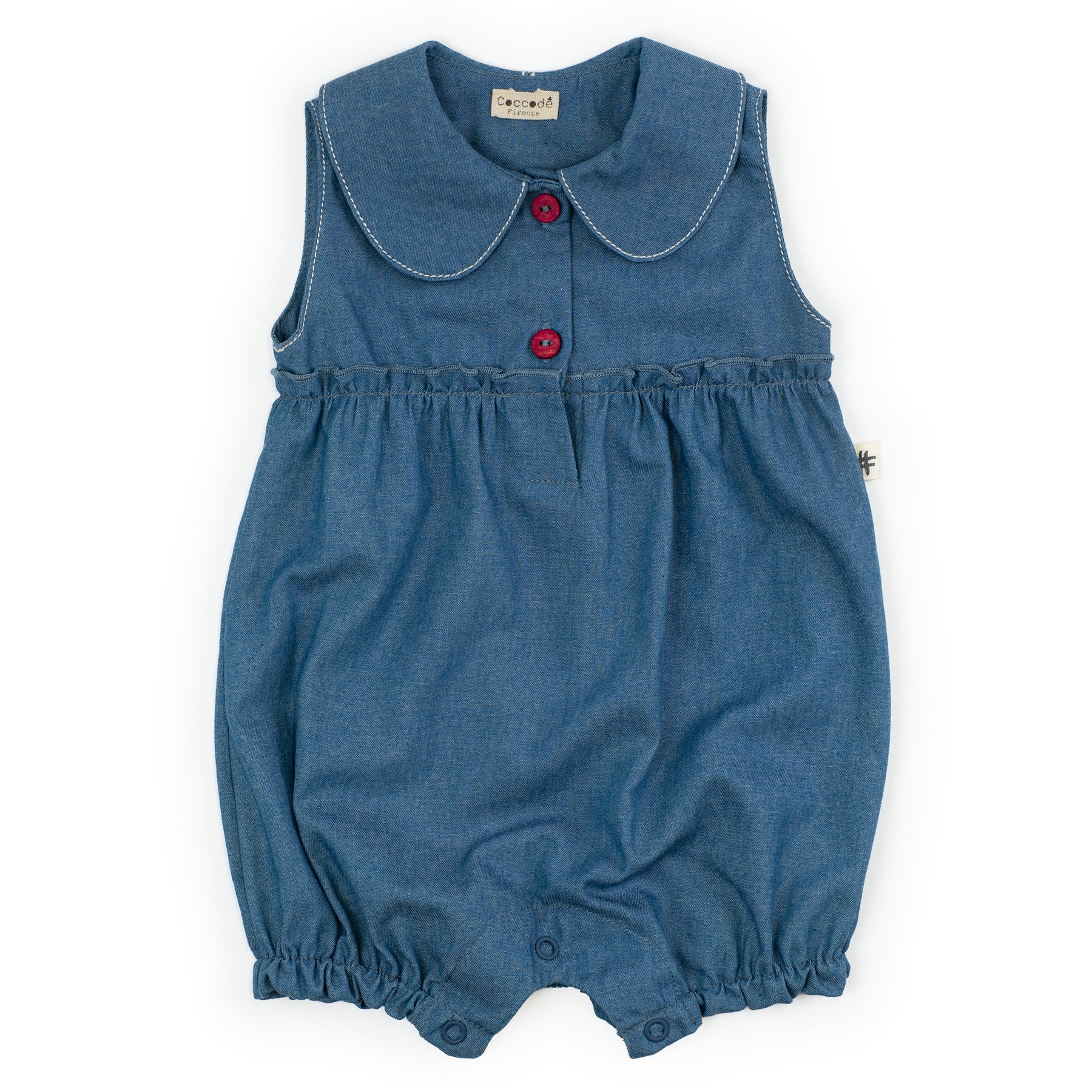 Blue baby romper with red buttons on a white background