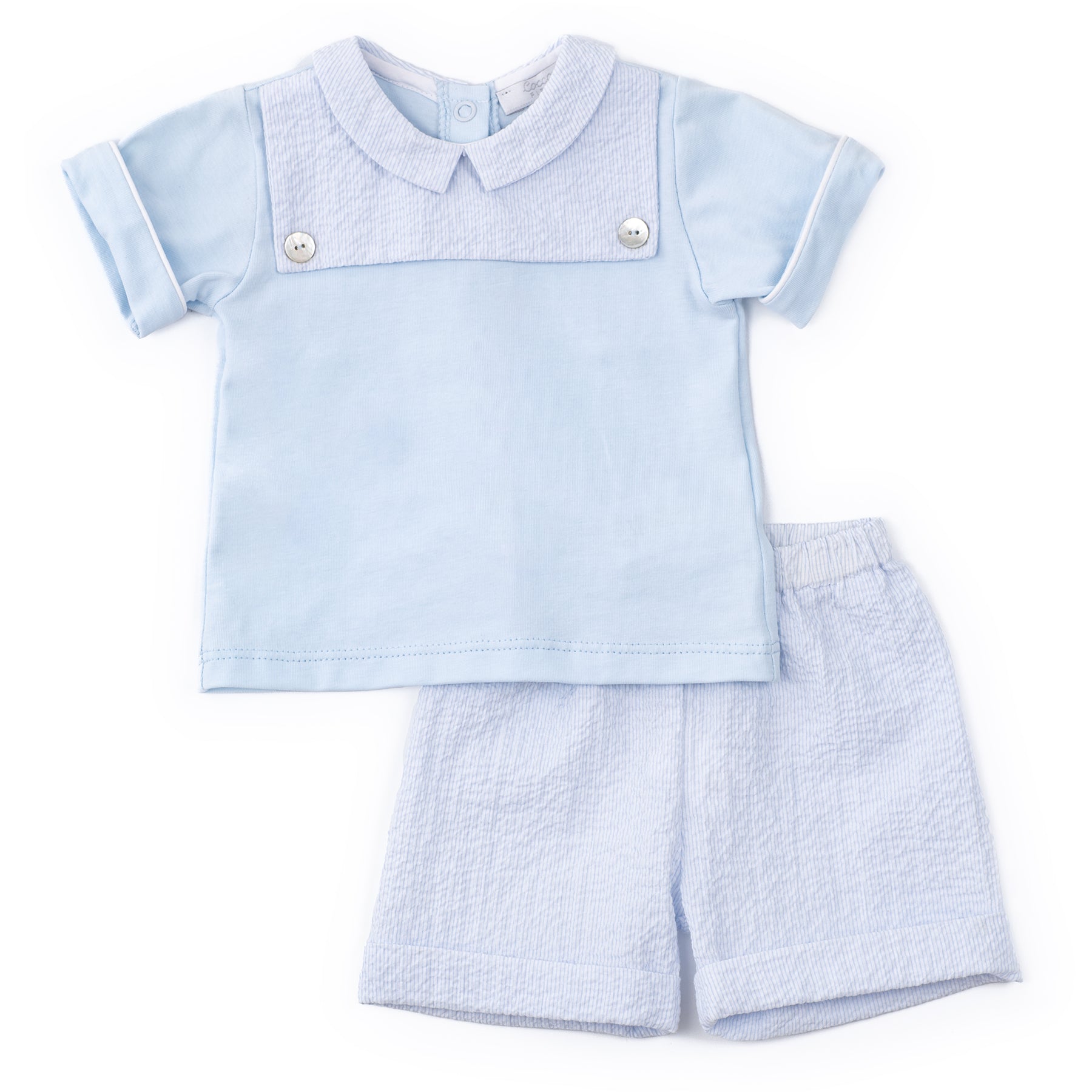 Light blue children's outfit with shirt and shorts on a white background