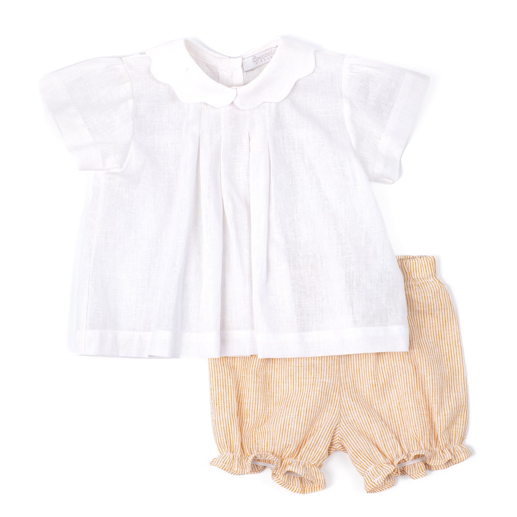 White blouse with yellow ruffled shorts on a white background