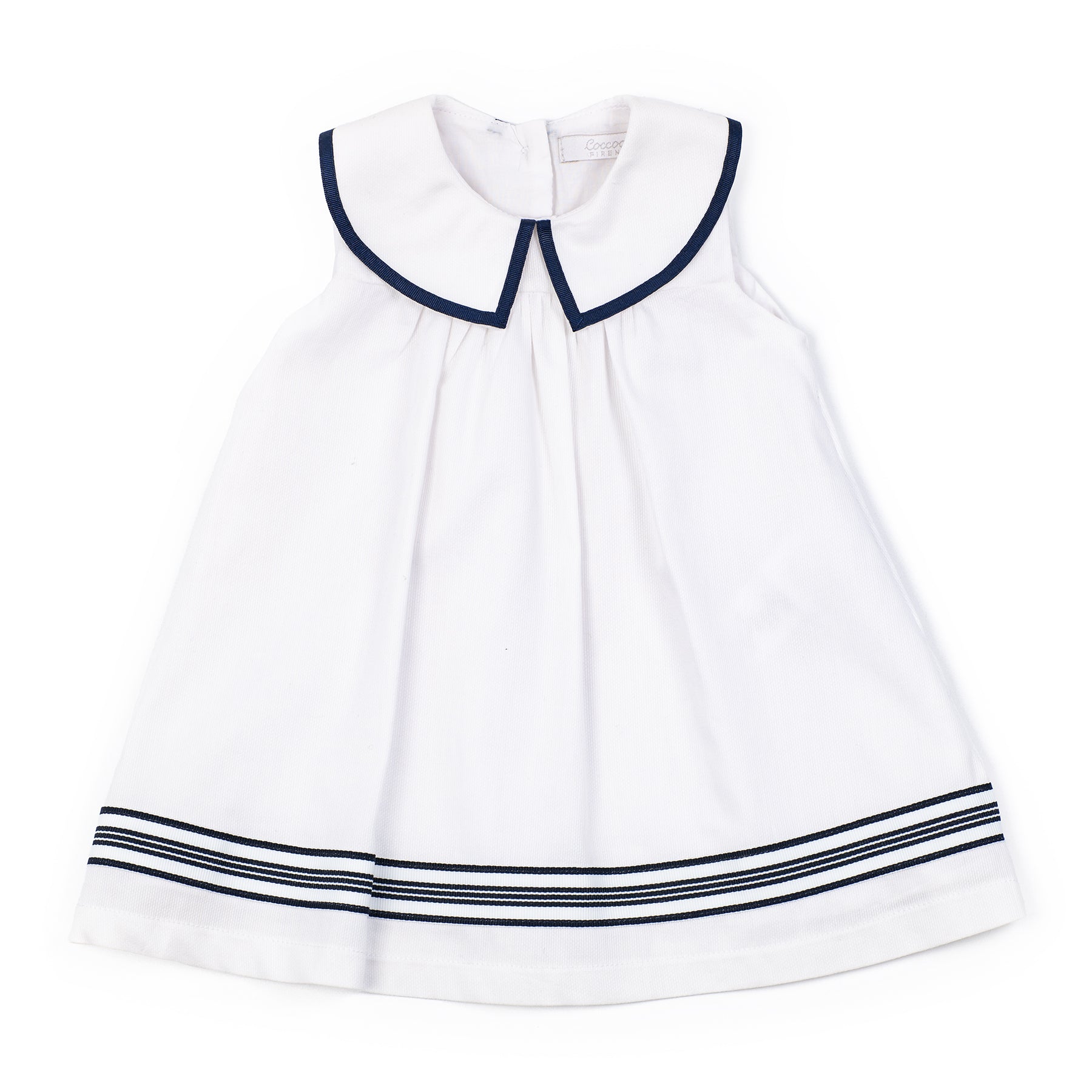 White dress with navy trim on a white background