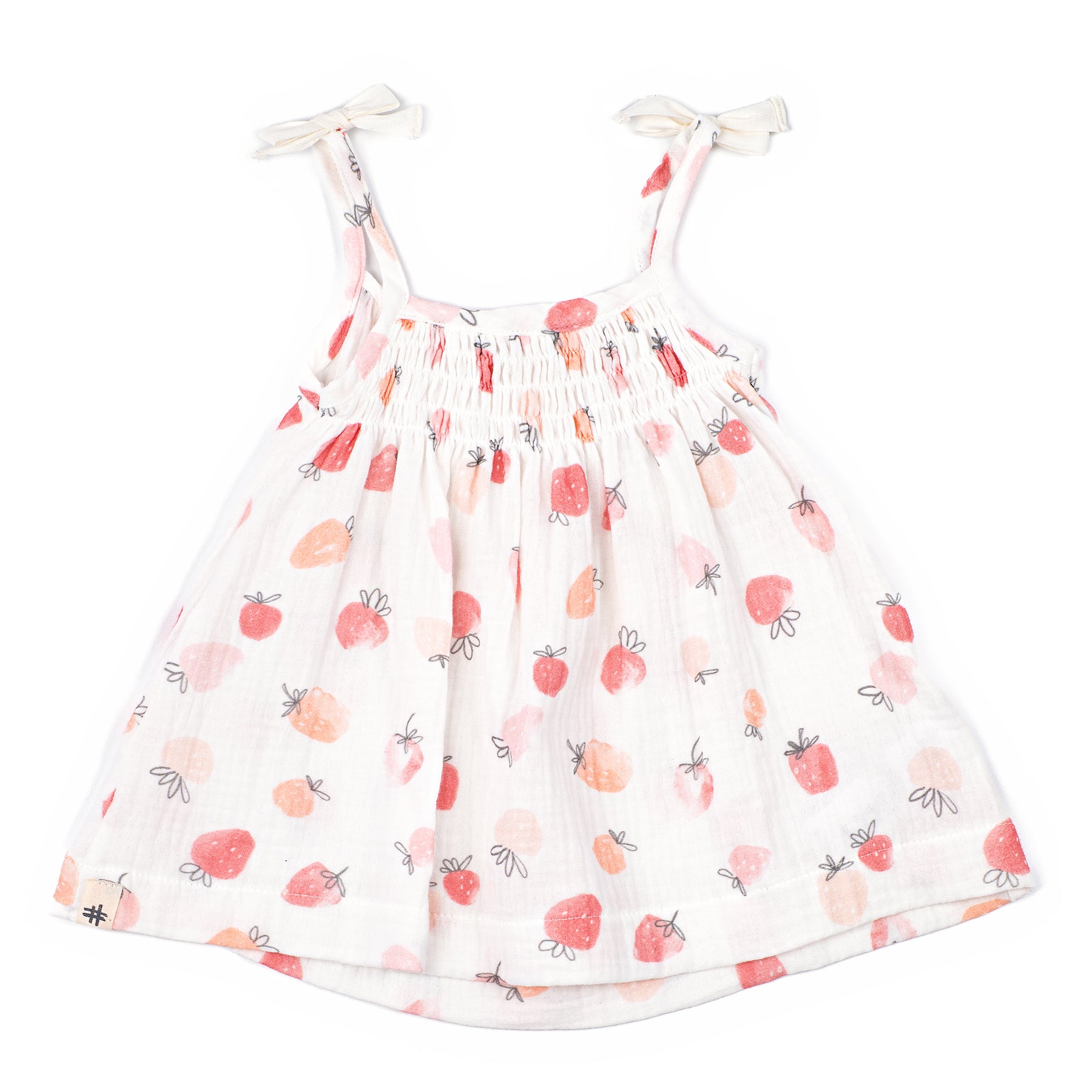 White dress with strawberry pattern on a white background