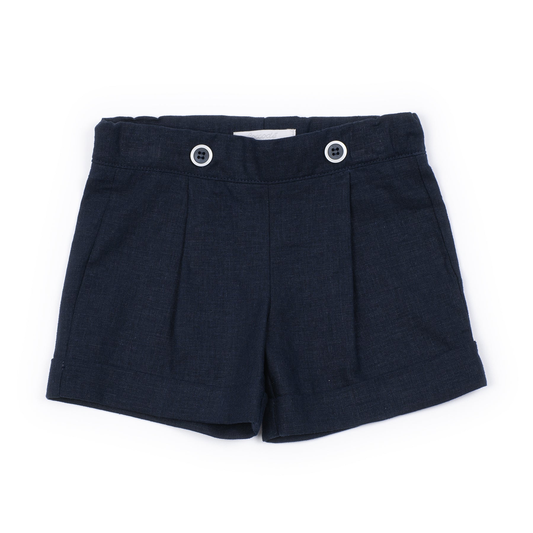 Navy pleated shorts with button details on a white background