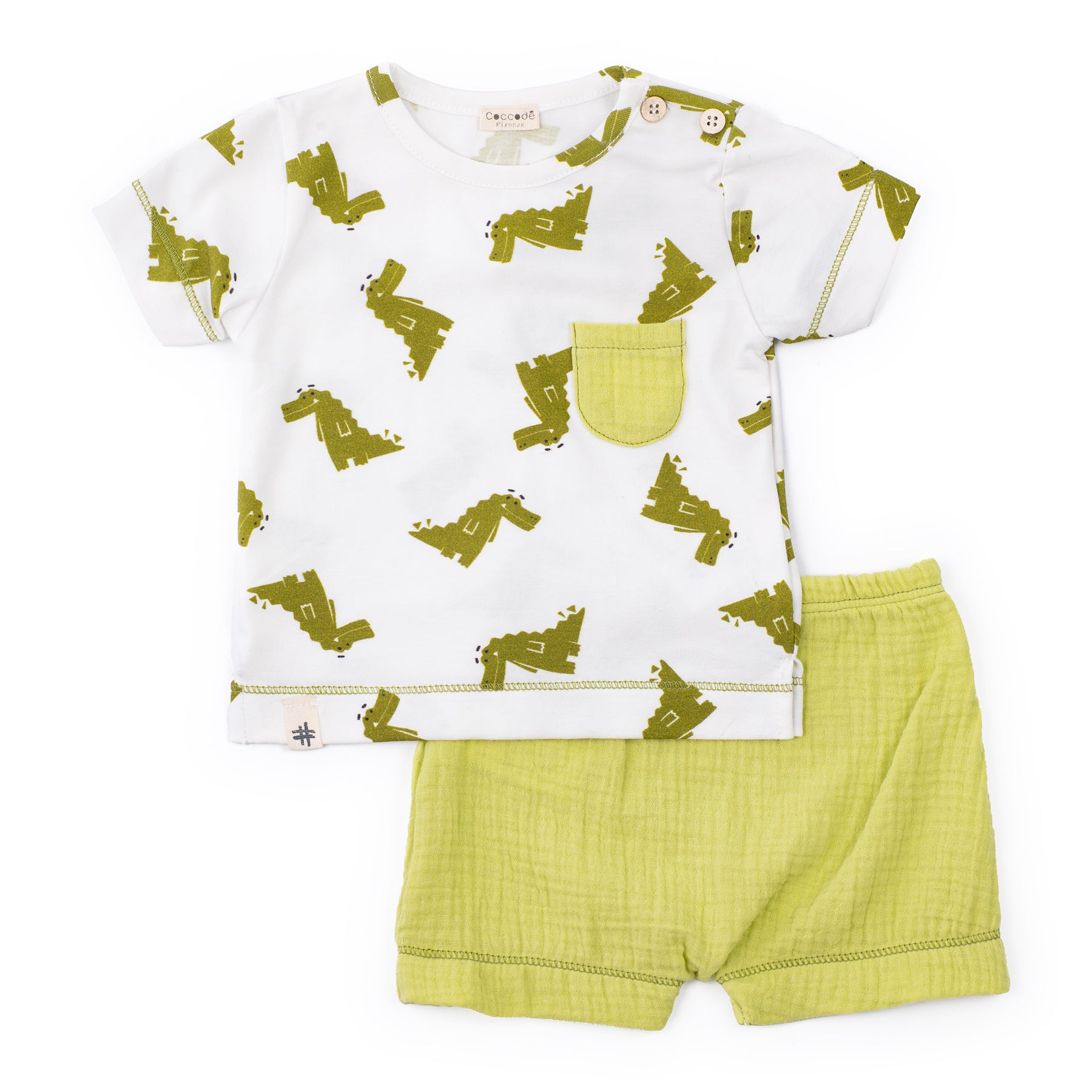 Children's outfit with white shirt and green shorts featuring a pattern on a white background