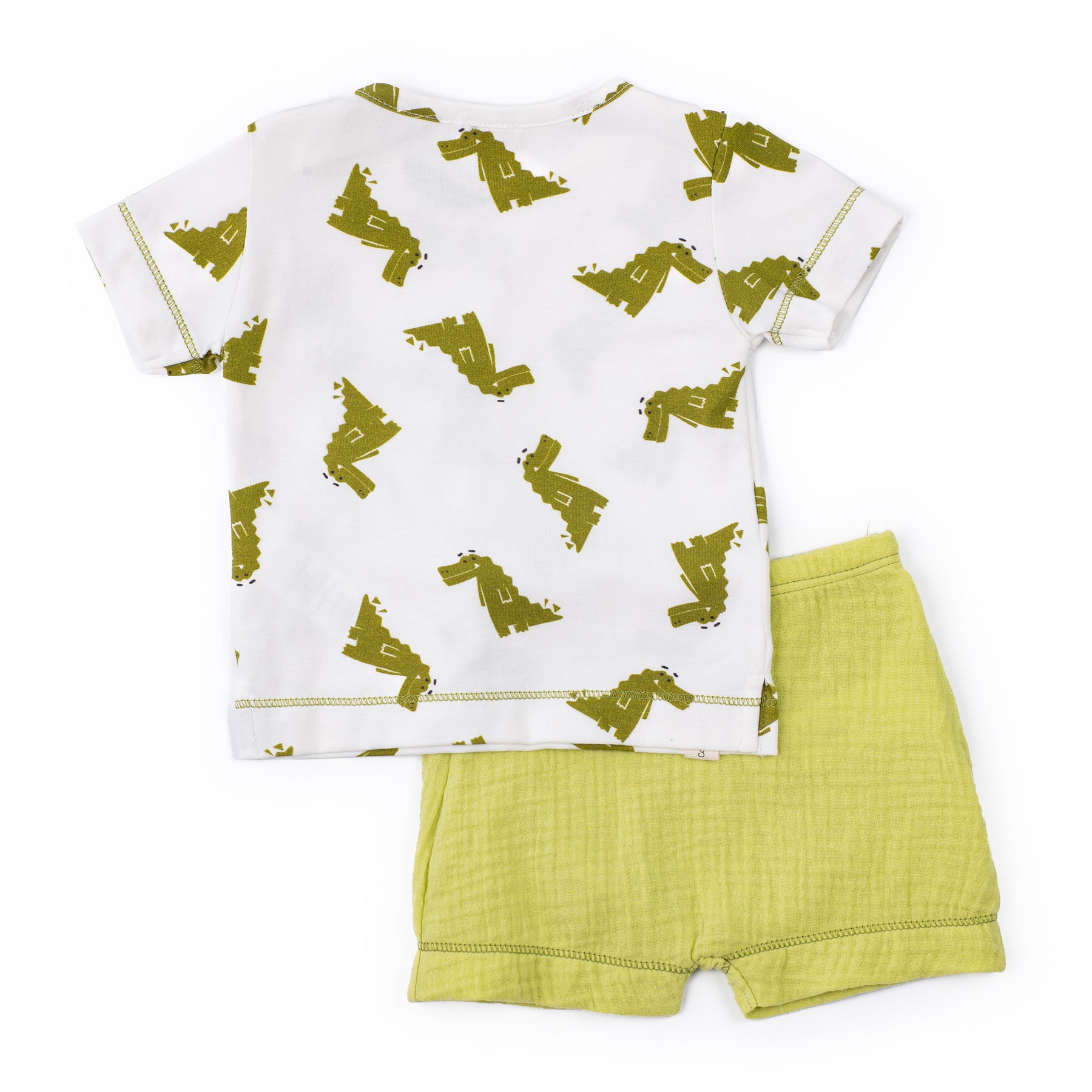 Children's outfit with white shirt and green shorts on a white background