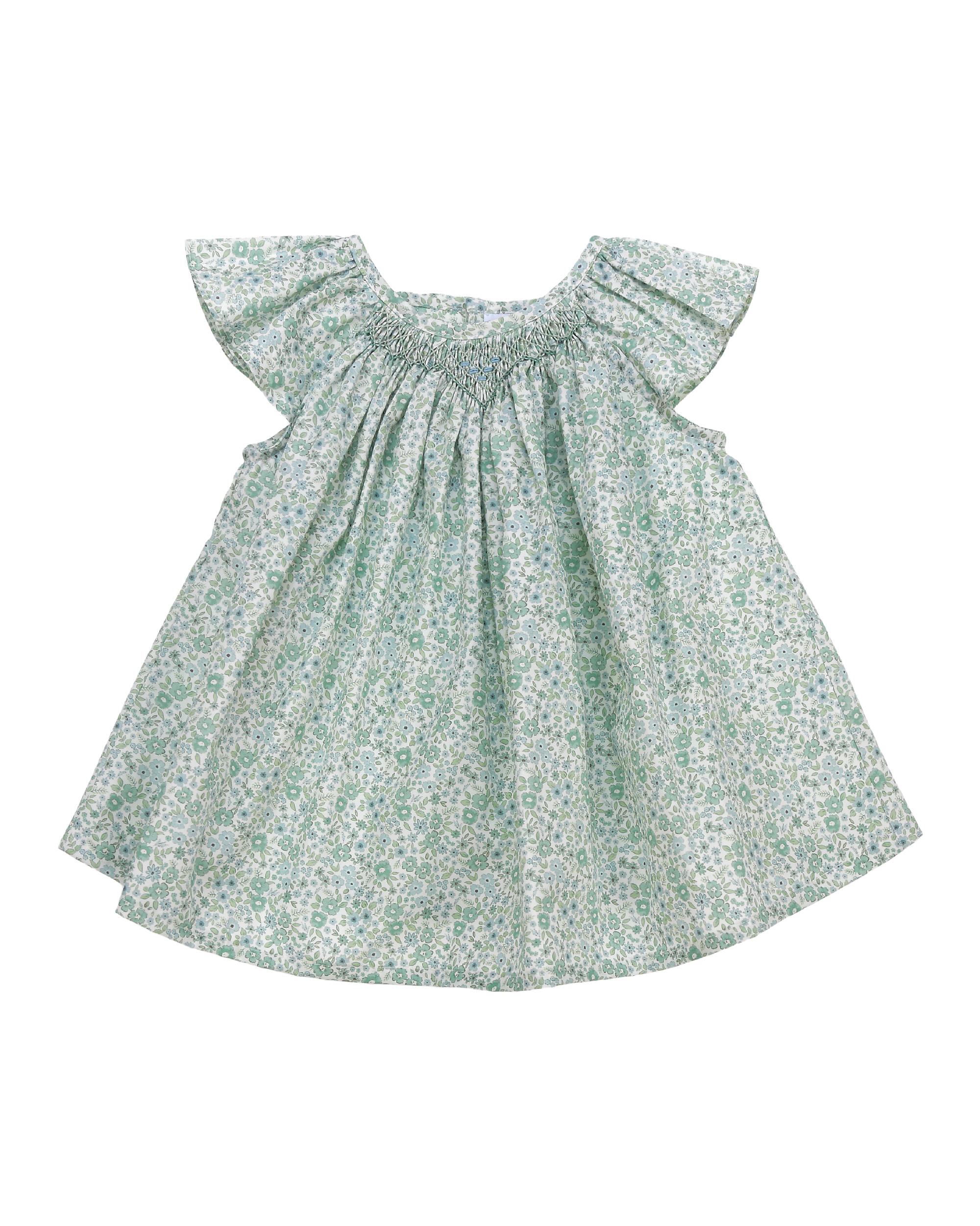 Green floral shirt with ruffled sleeves on a white background