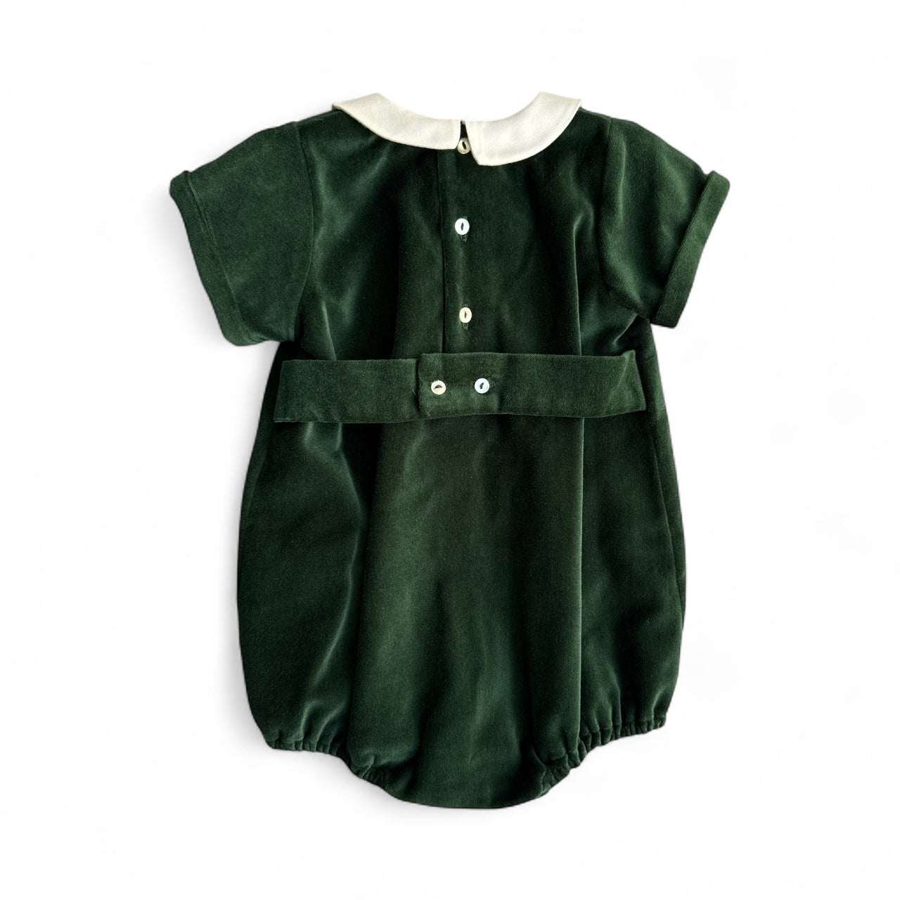 Green baby romper with white collar on a white background