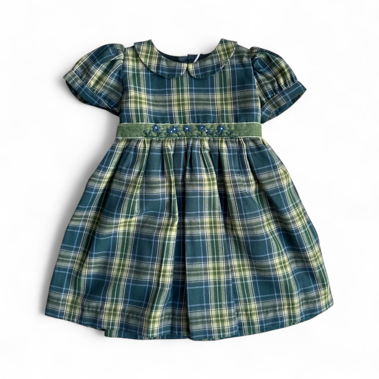Green plaid dress with short sleeves on a white background