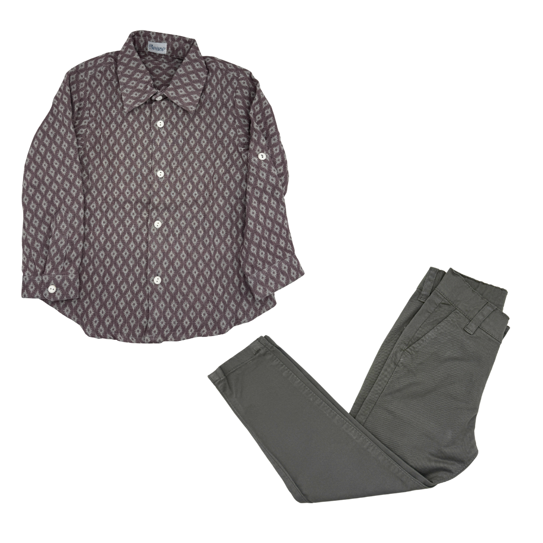 Patterned shirt and gray pants on a white background