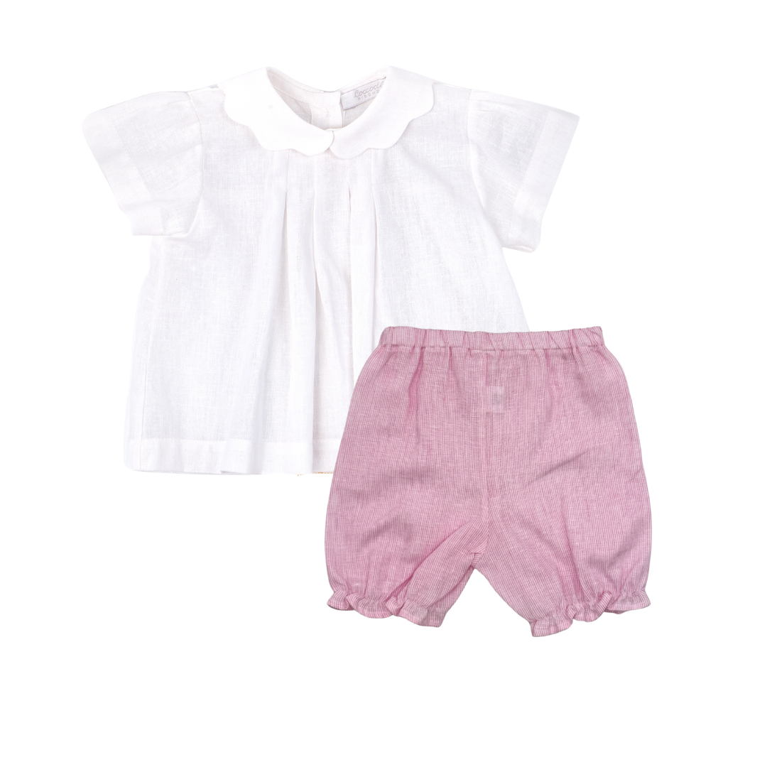 White top and pink shorts set on a white background