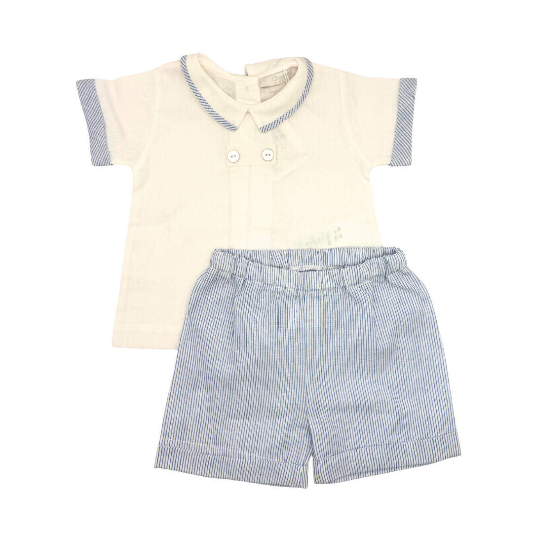 Children's outfit with cream shirt and blue striped shorts on a white background